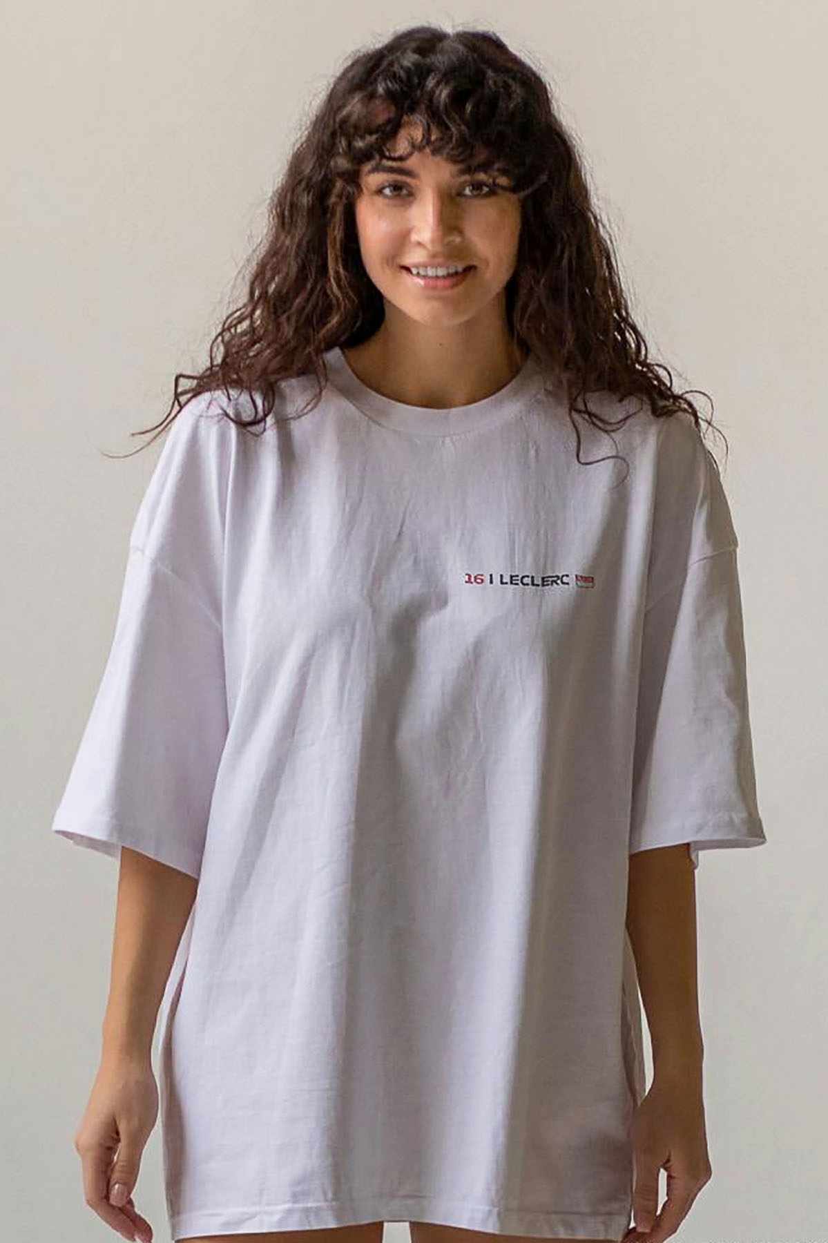 Model wearing Utmost Province Ferrari F1 race car t shirt, showcasing the front graphic design on the custom F1 shirt.