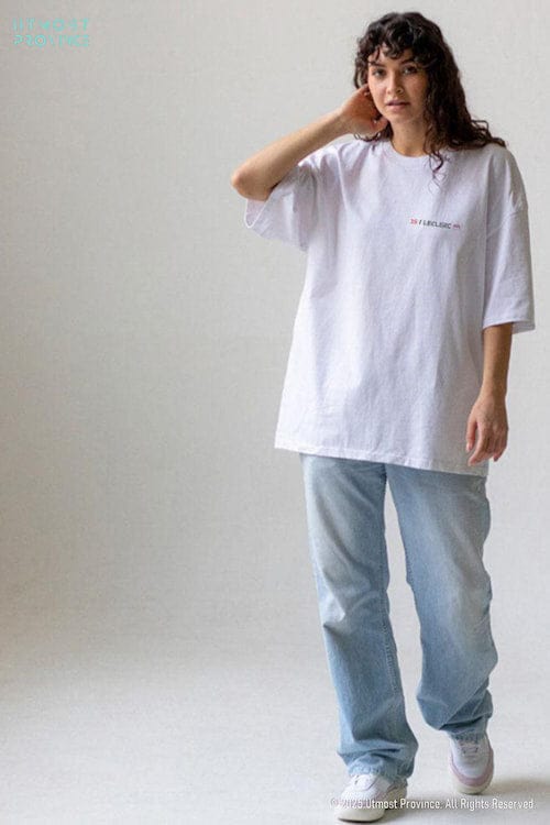 Model wearing a custom Ferrari-inspired t shirt from Utmost Province's Charles Leclerc inspired merch collection.