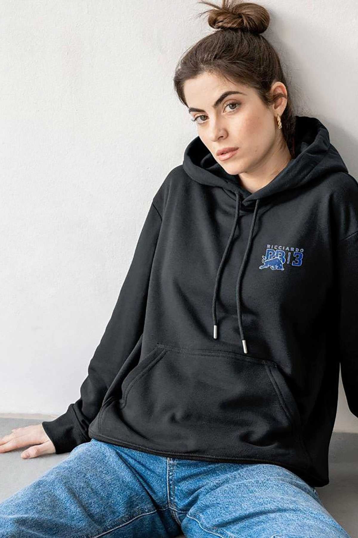 Person wearing a black custom Daniel Ricciard inspired hoodie while sitting on the floor.