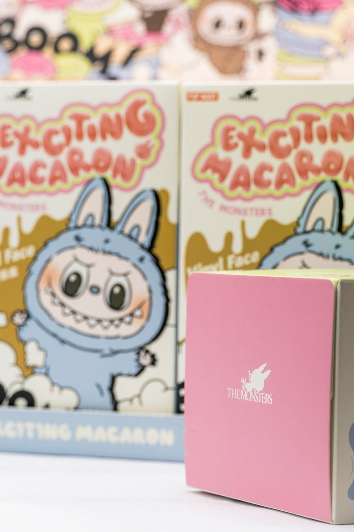 Exciting Macaron Labubu Blind box, showing an authentic Pop Mart Labubu plush in front of a case.