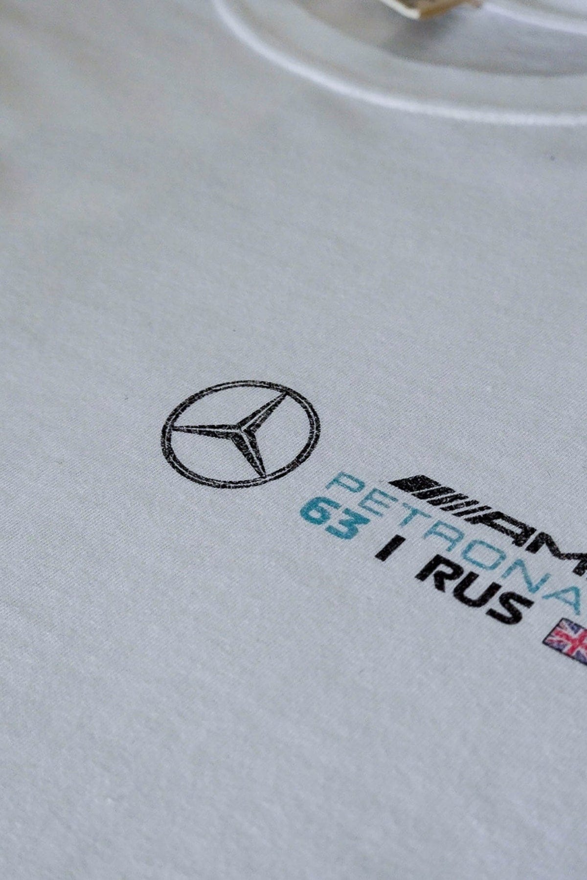 Front of a custom F1 Mercedes shirt, highlighting the front design handmade by Utmost Province.