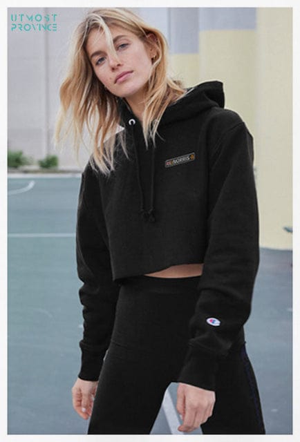 Model wearing a cropped hoodie, showcasing Utmost Province Women's F1 Merch collection.