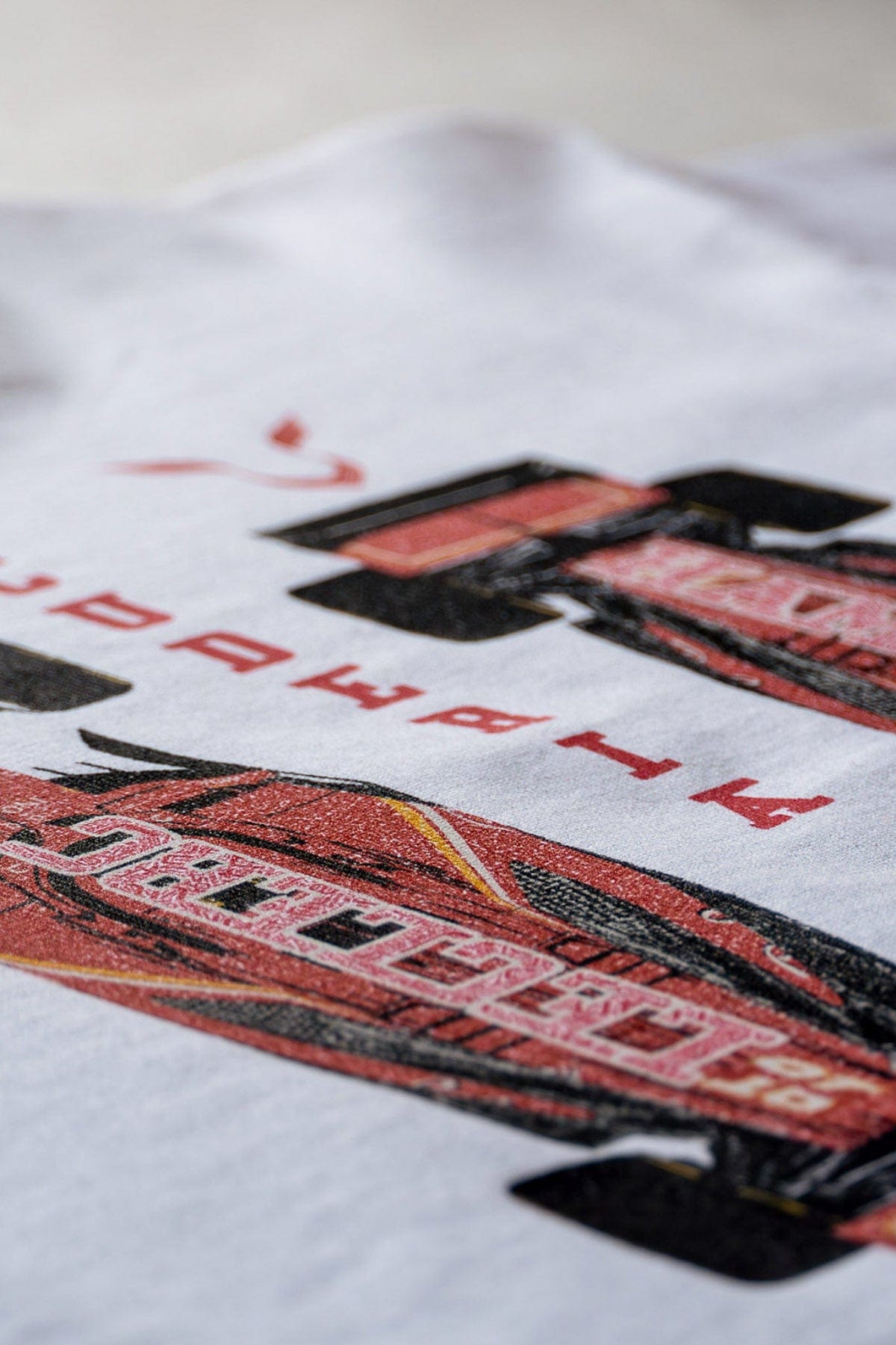 Close up of Utmost Province custom Ferrari inspired cropped graphic tee.