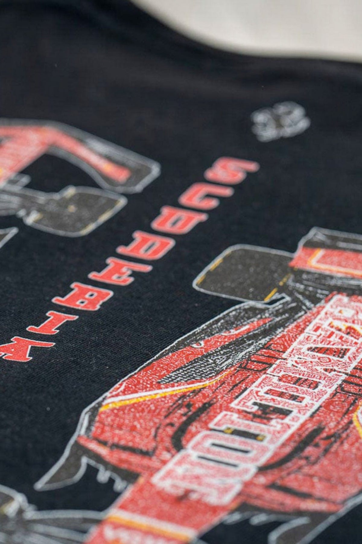 Close up of the back of a black Ferrari F1 shirt designed by Utmost Province.