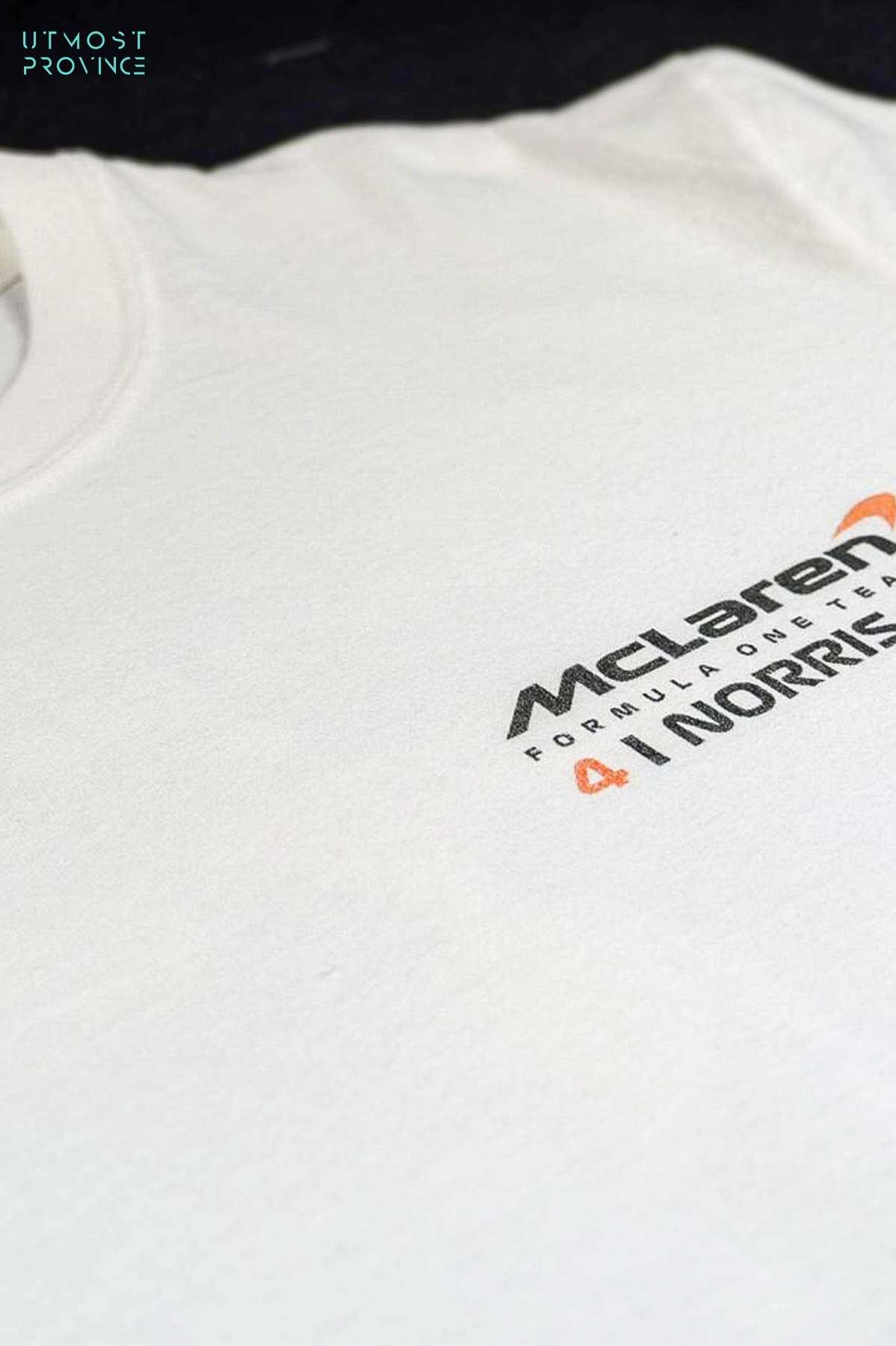 Utmost Province Lando Norris merch laid flat on a table, highlighting the graphic design on the front of the Mclaren F1 merch for men and women.