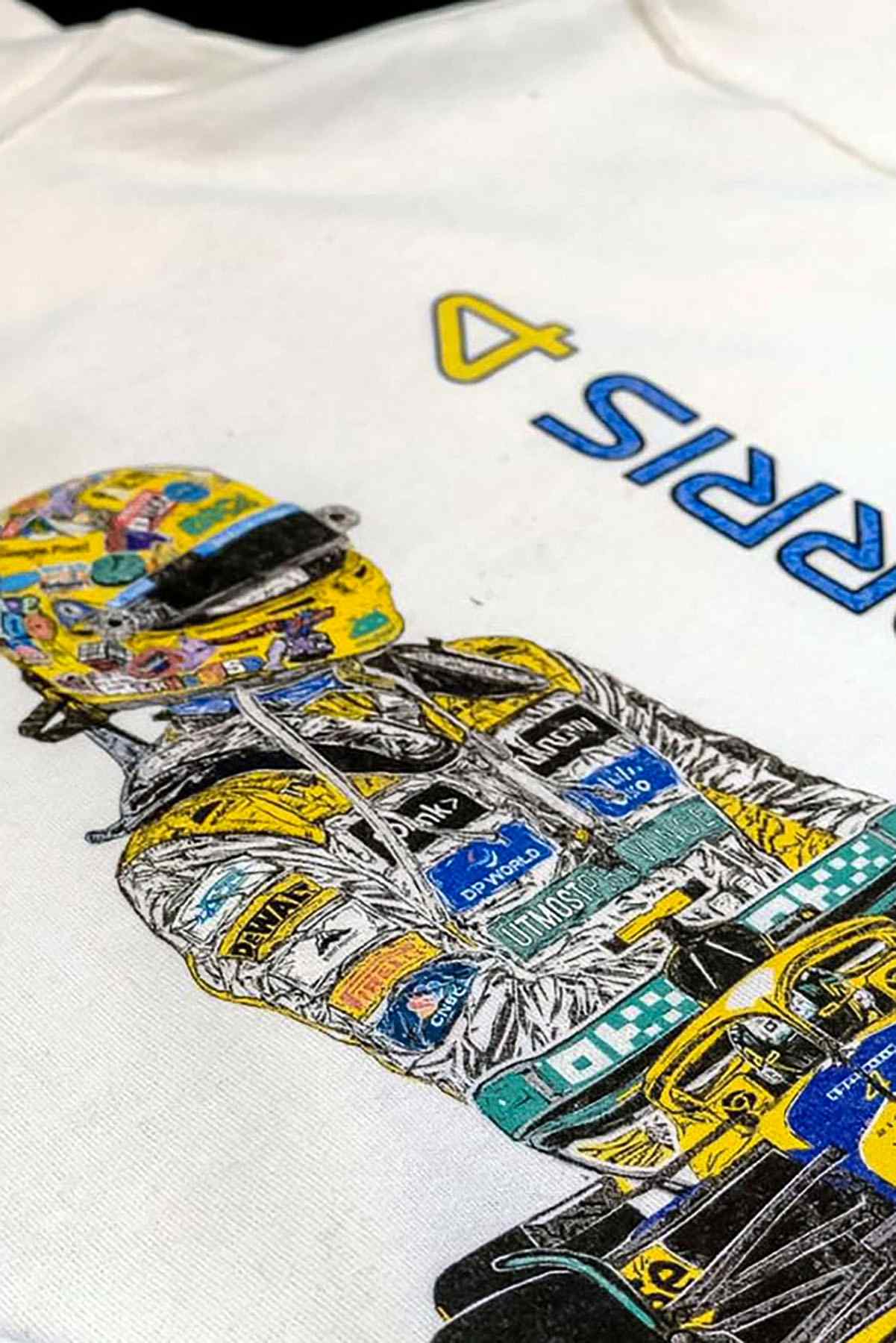 Utmost Province Lando Norris inspired Senna Mclaren F1 hoodie laid flat on a table, highlighting the graphic design on the back of the custom F1 hoodie for men and women.