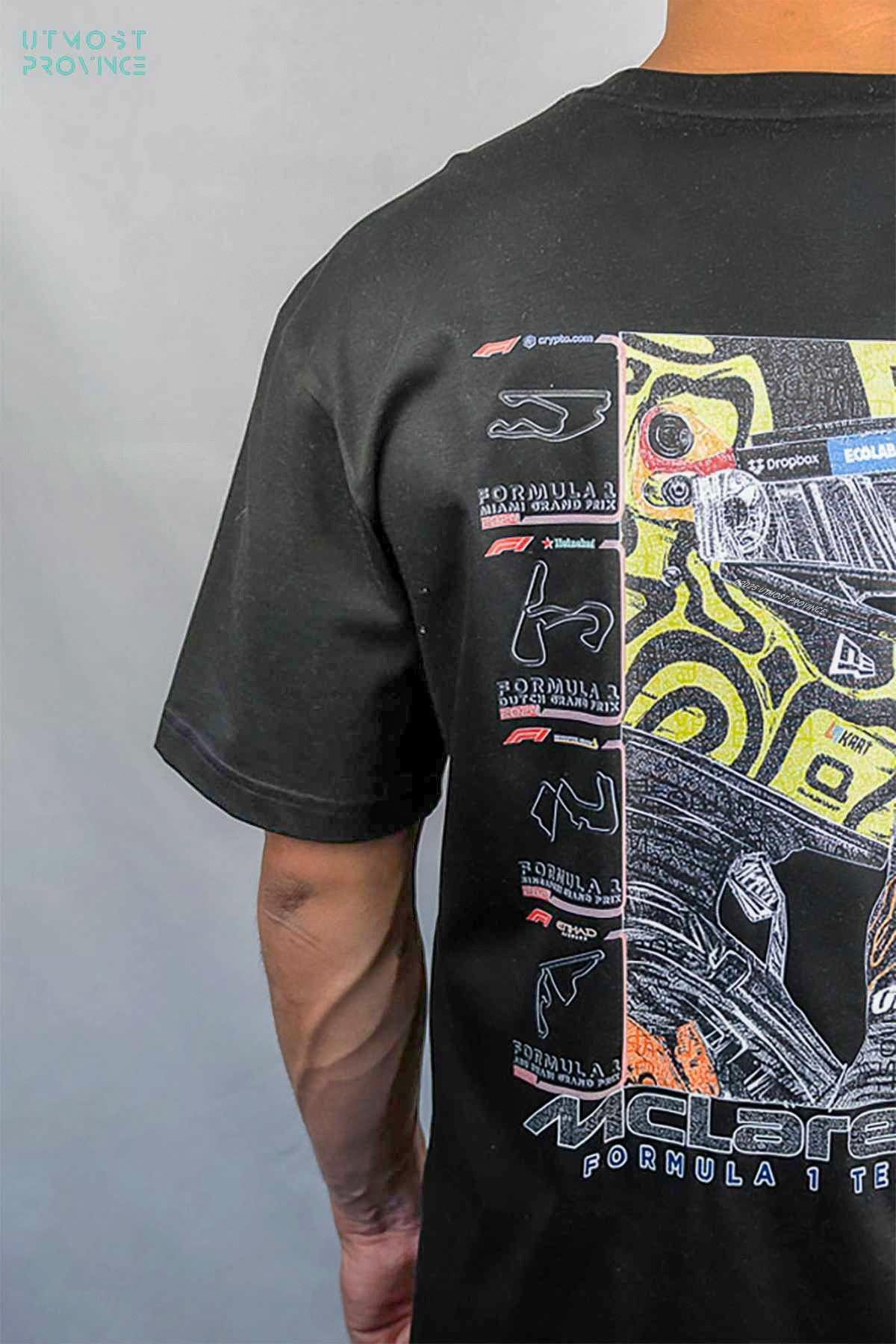 Model wearing Utmost Province Mclaren F1 shirt inspired by Lando Norris, showcasing the exclusive custom graphic design on the back of the Mclaren F1 merch.