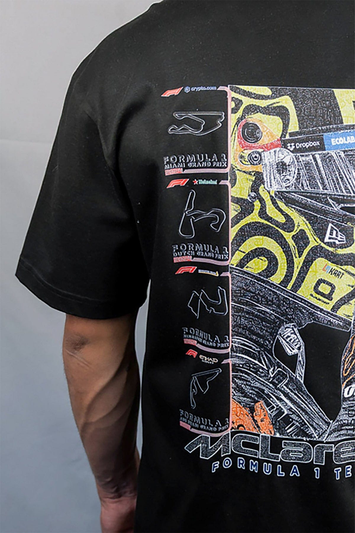 Person wearing a black custom Mclaren shirt inspired by Lando Norris.