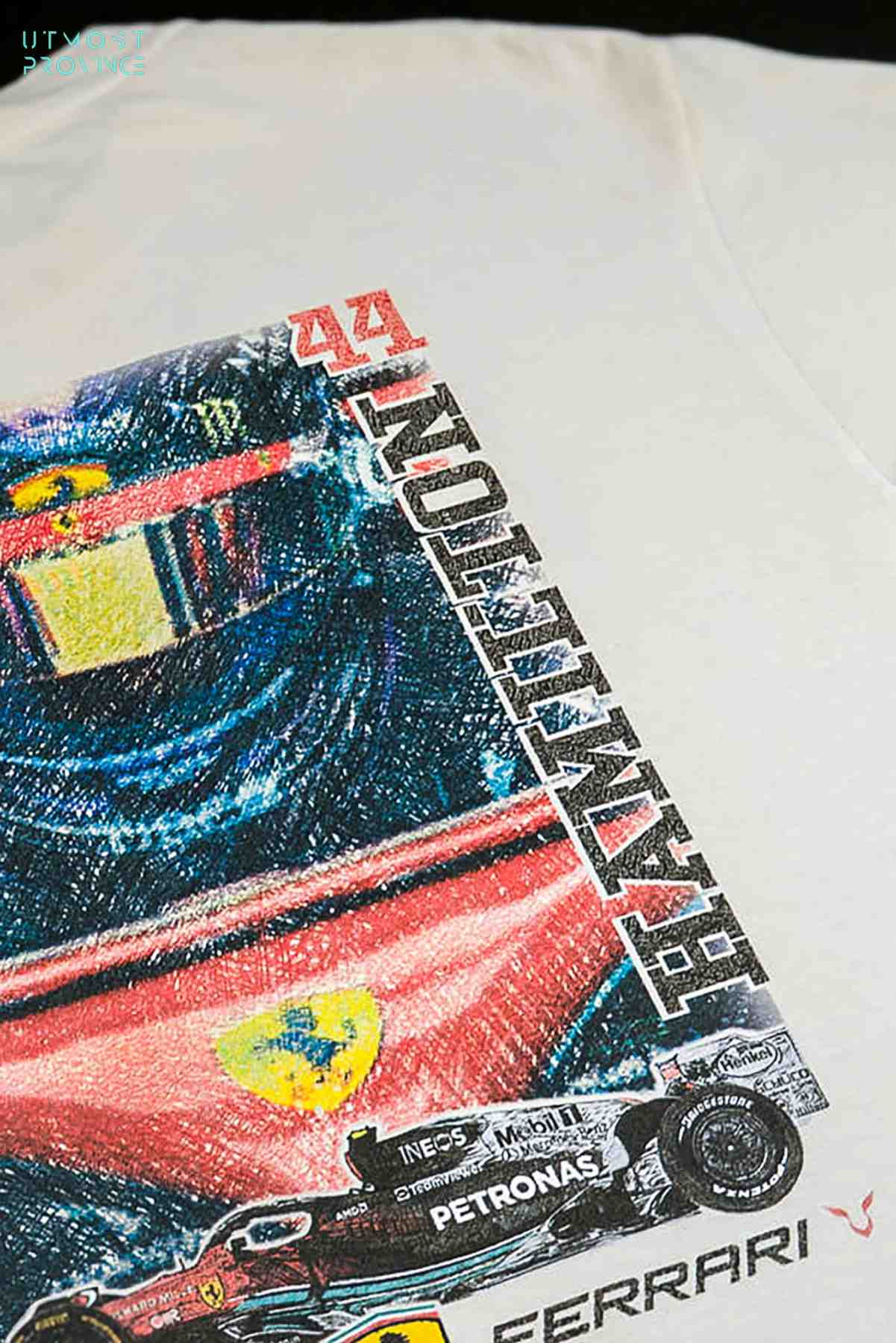 Utmost Province Lewis Hamilton inspired Ferrari F1 shirt laid flat on a table, highlighting the unique graphic design on the back of the retro F1 shirt.