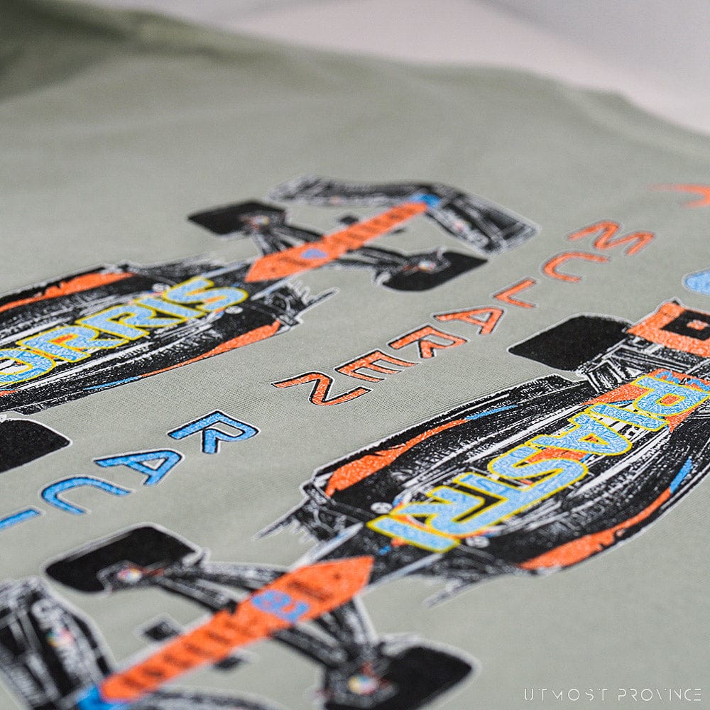 Close up of the back of a custom Mclaren F1 shirt, showcasing the unique design on the back of Utmost Province's graphic tees