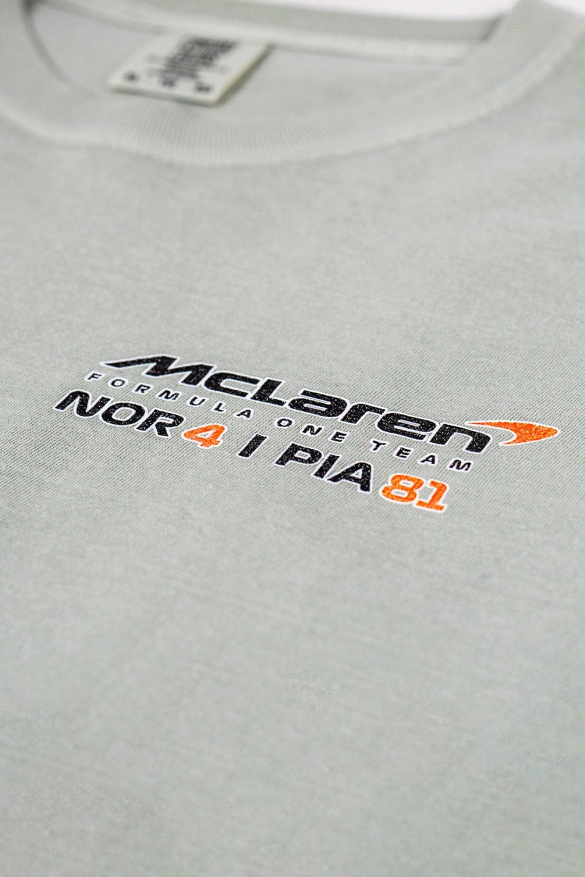 Close up of Utmost Province custom F1 t shirt, featuring a design inspired by Lando Norris & Oscar Piastri.
