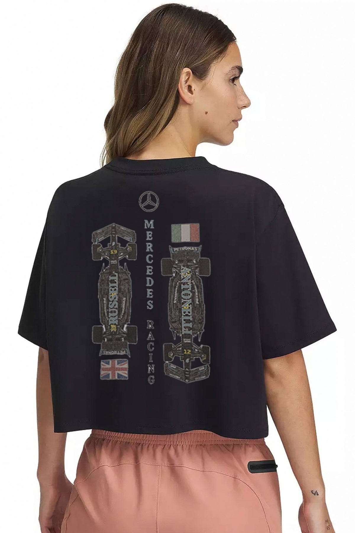 Person wearing a black crop top shirt, featuring Utmost Province custom Mercedes F1 graphic design printed on the back.