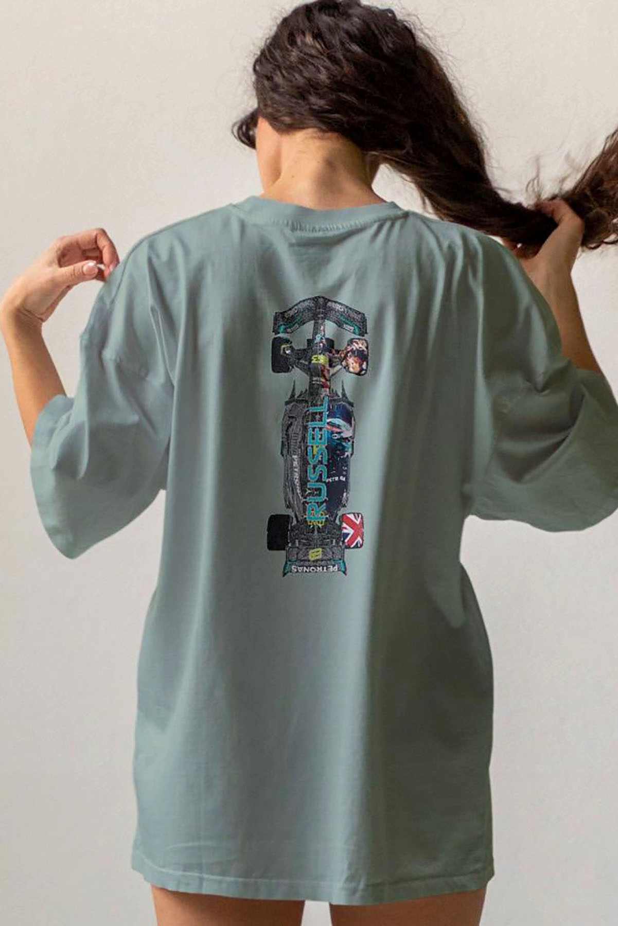 Model wearing Utmost Province Mercedes F1 t-shirt inspired by George Russell, showcasing the graphic design on the back of the cotton t shirt.