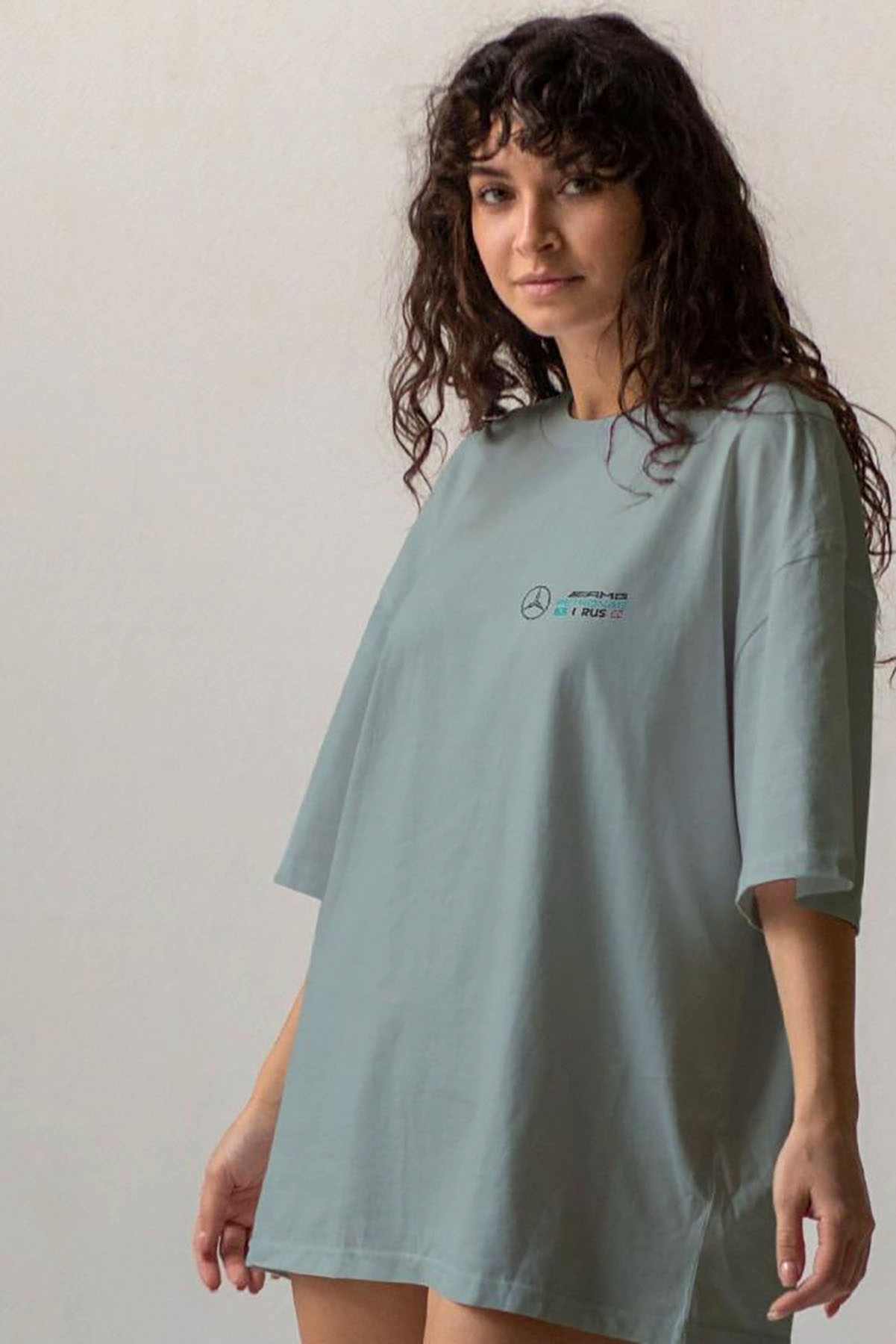 Model wearing Utmost Province George Russell Mercedes F1 shirt, showcasing the graphic design on the front of the graphic tee.