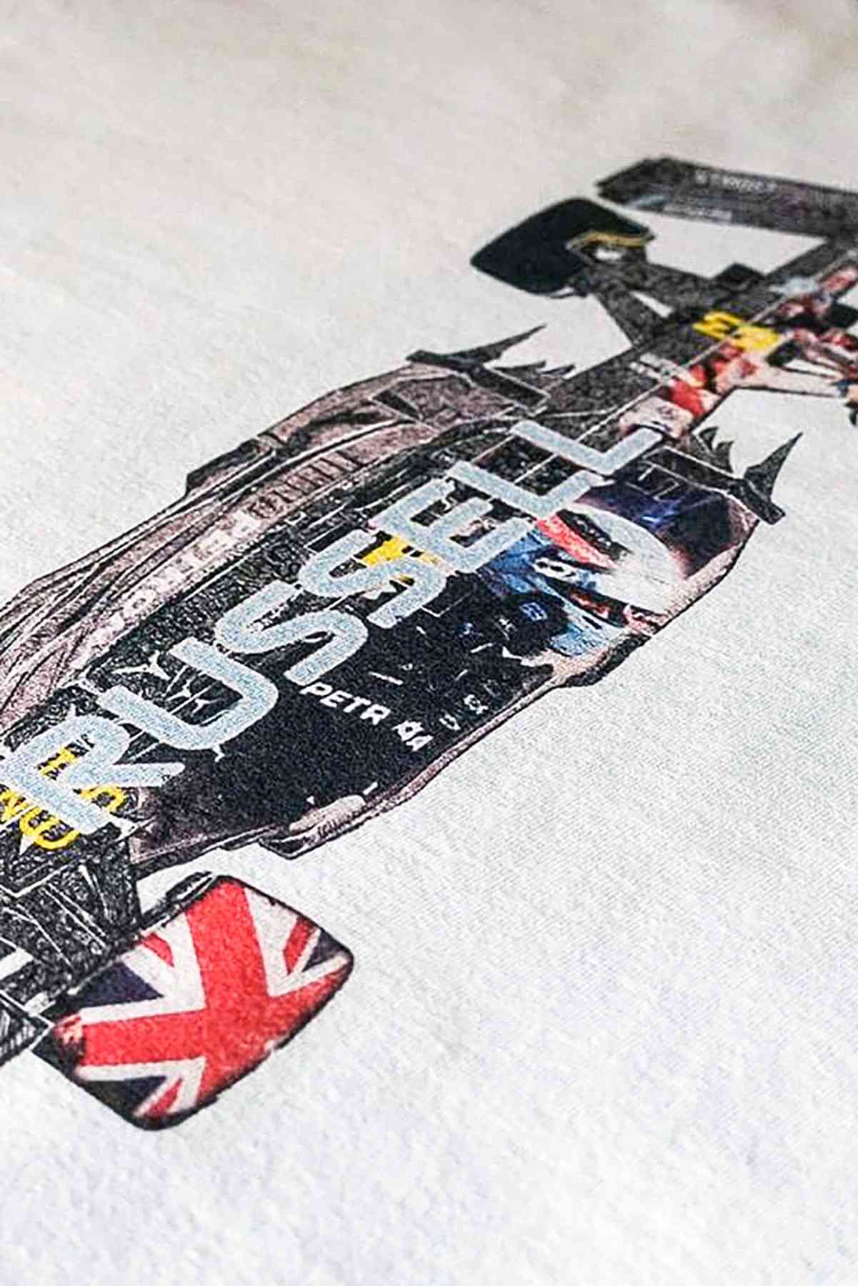 Utmost Province Mercedes race car t-shirt laid flat on a table, highlighting the graphic design on the back of the George Russell merch.