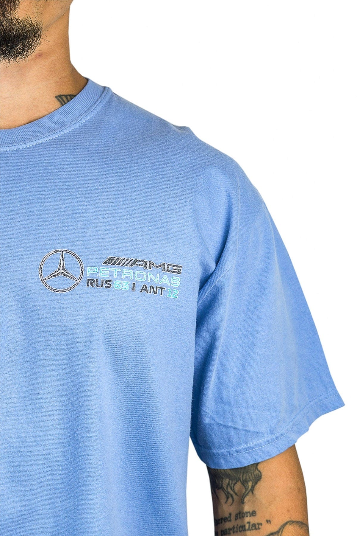 Person wearing a violet Comfort Colors t-shirt, featuring Utmost Province custom Mercedes F1 Team logo..