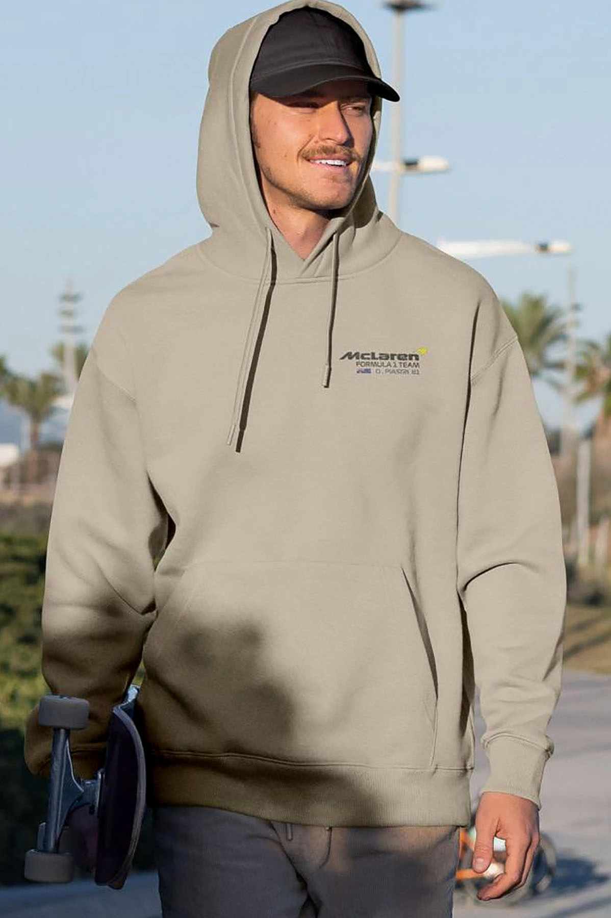 Model wearing Utmost Province Oscar Piastri hoodie, showcasing the graphic design on the front of the Mclaren F1 merch.