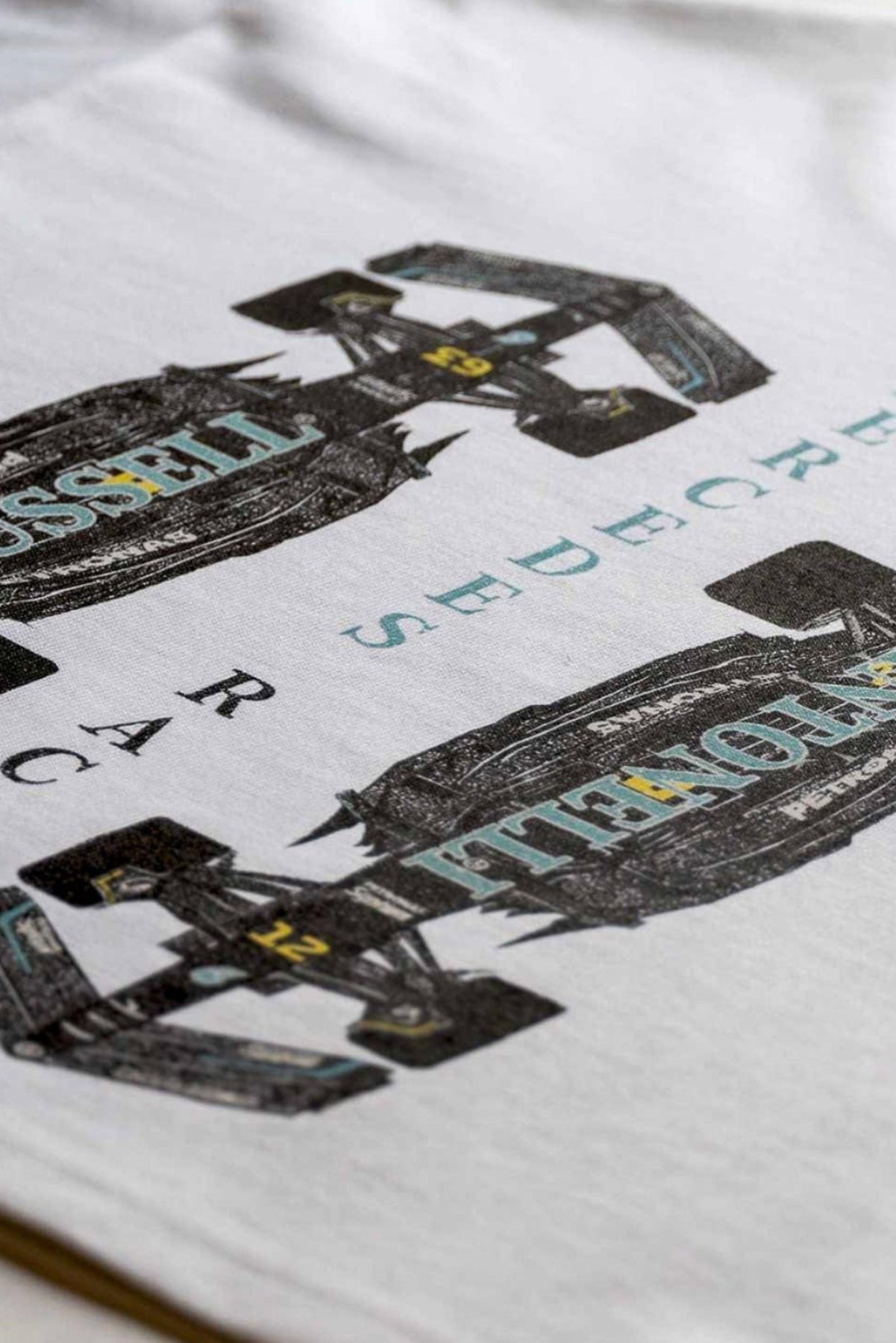 Short clip of Utmost Province® revealing their handmade Silver Era Racing Crop Top shirt inspired by George Russell and Kimi Antonelli.