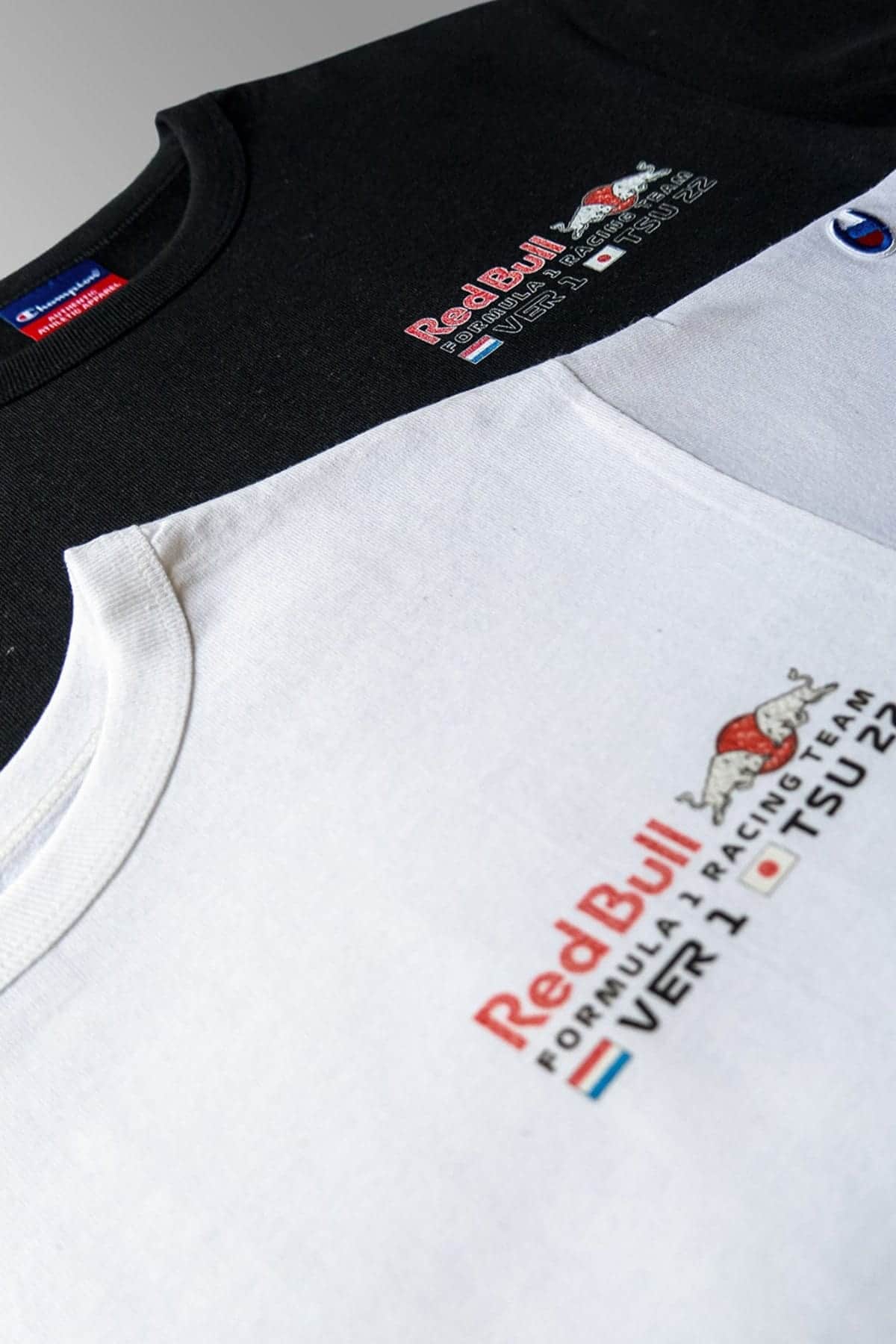 Front of a black and white Red Bull Racing crop top shirt, designed by Utmost Province®.