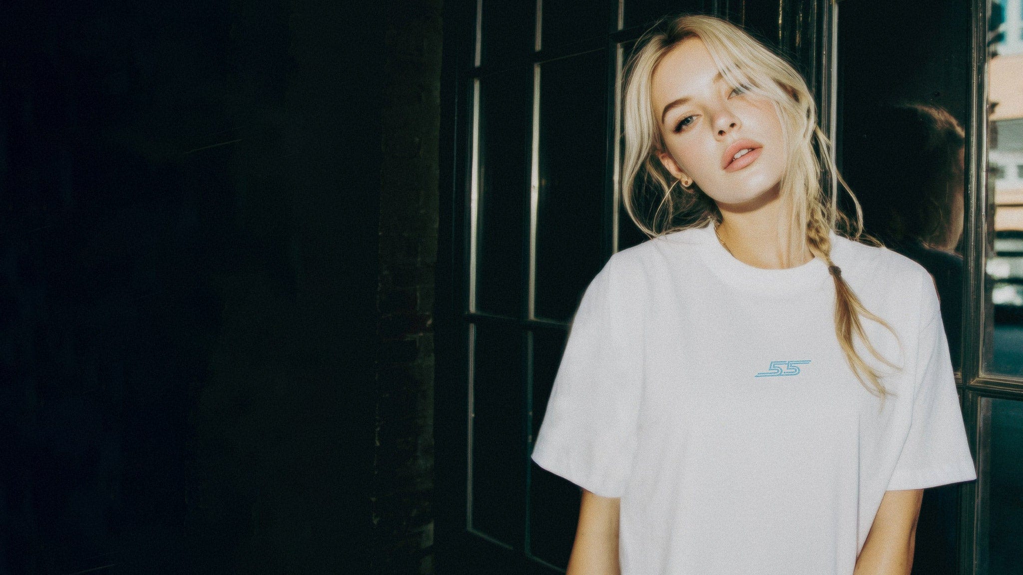 Woman in a custom F1 shirt, handcrafted by Utmost Province.