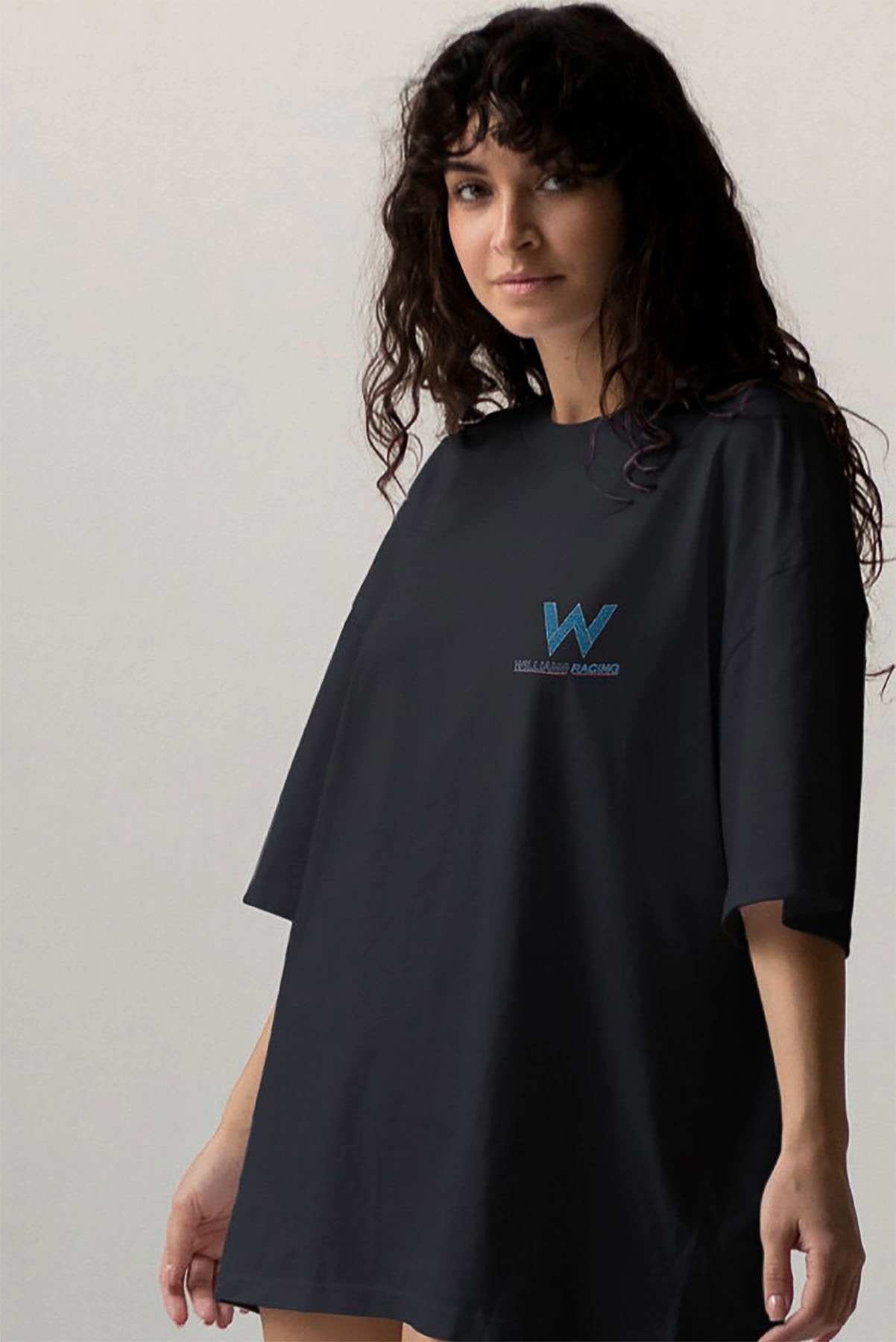 Model wearing Utmost Province Williams F1 team t shirt, showcasing the graphic design on the front of the unisex cotton t shirt.