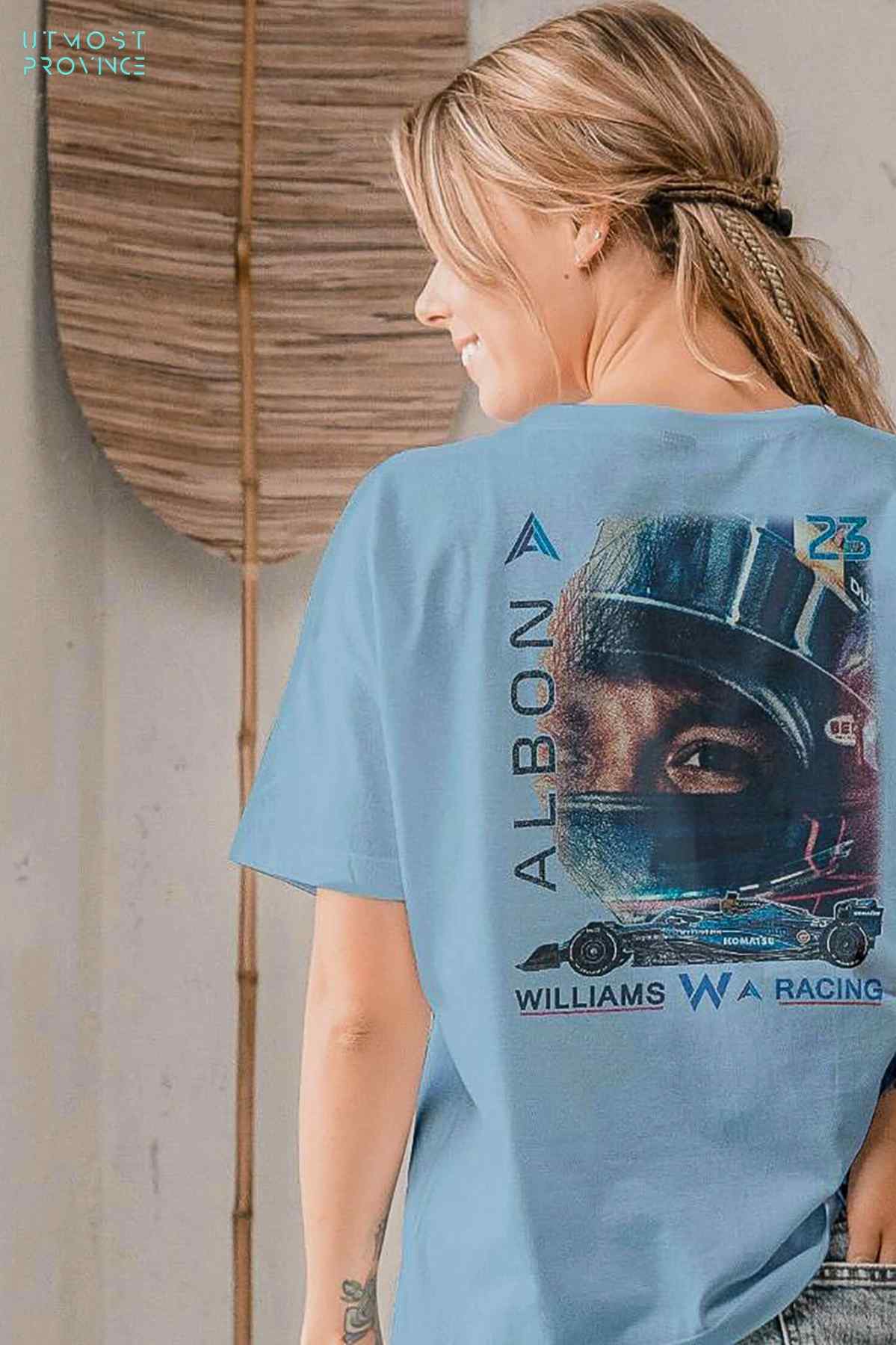 Model wearing Utmost Province Williams F1 shirt inspired by Alex Albon, showcasing the graphic design on the back of the F1 t shirt.