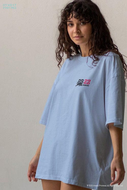 Model showcasing a Visa Cash App RB F1 team shirt from Utmost Province's Yuki Tsunoda Merch collection.