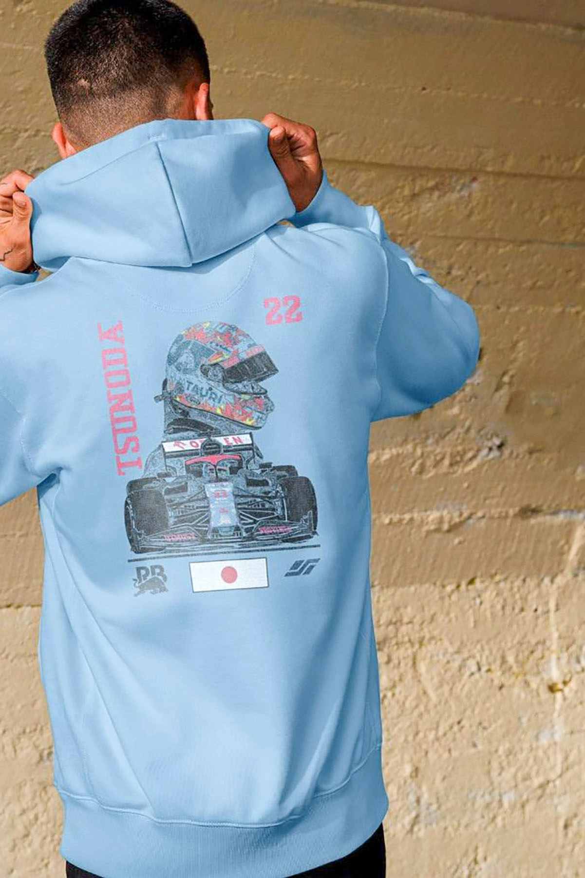 Model wearing Utmost Province Yuki Tsunoda F1 hoodie, showcasing the graphic design on the back of the Formula 1 hoodie.