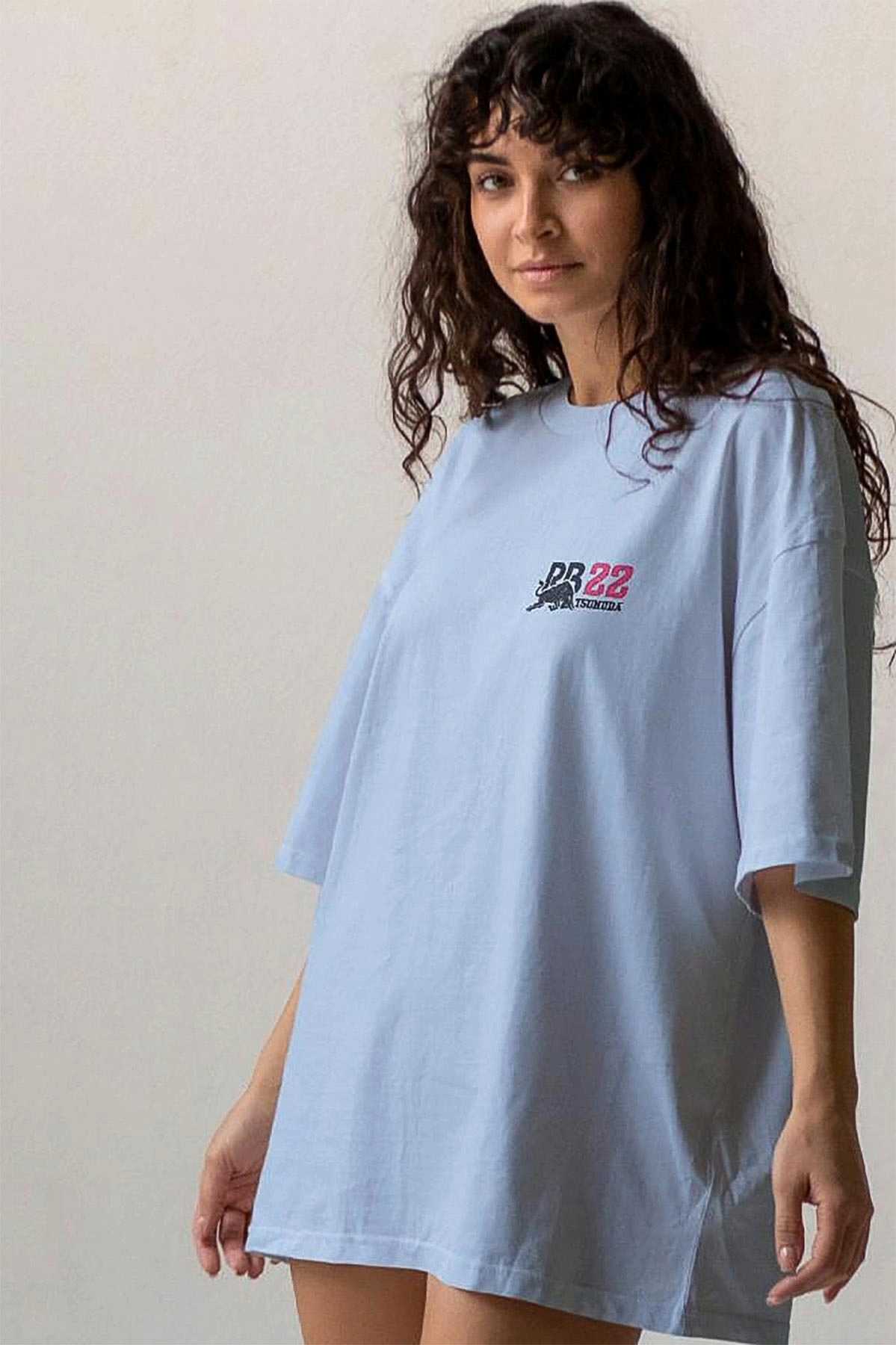 Model wearing a Red Bull F1 shirt, showcasing the graphic design on the front of the custom Yuki Tsunoda merch.