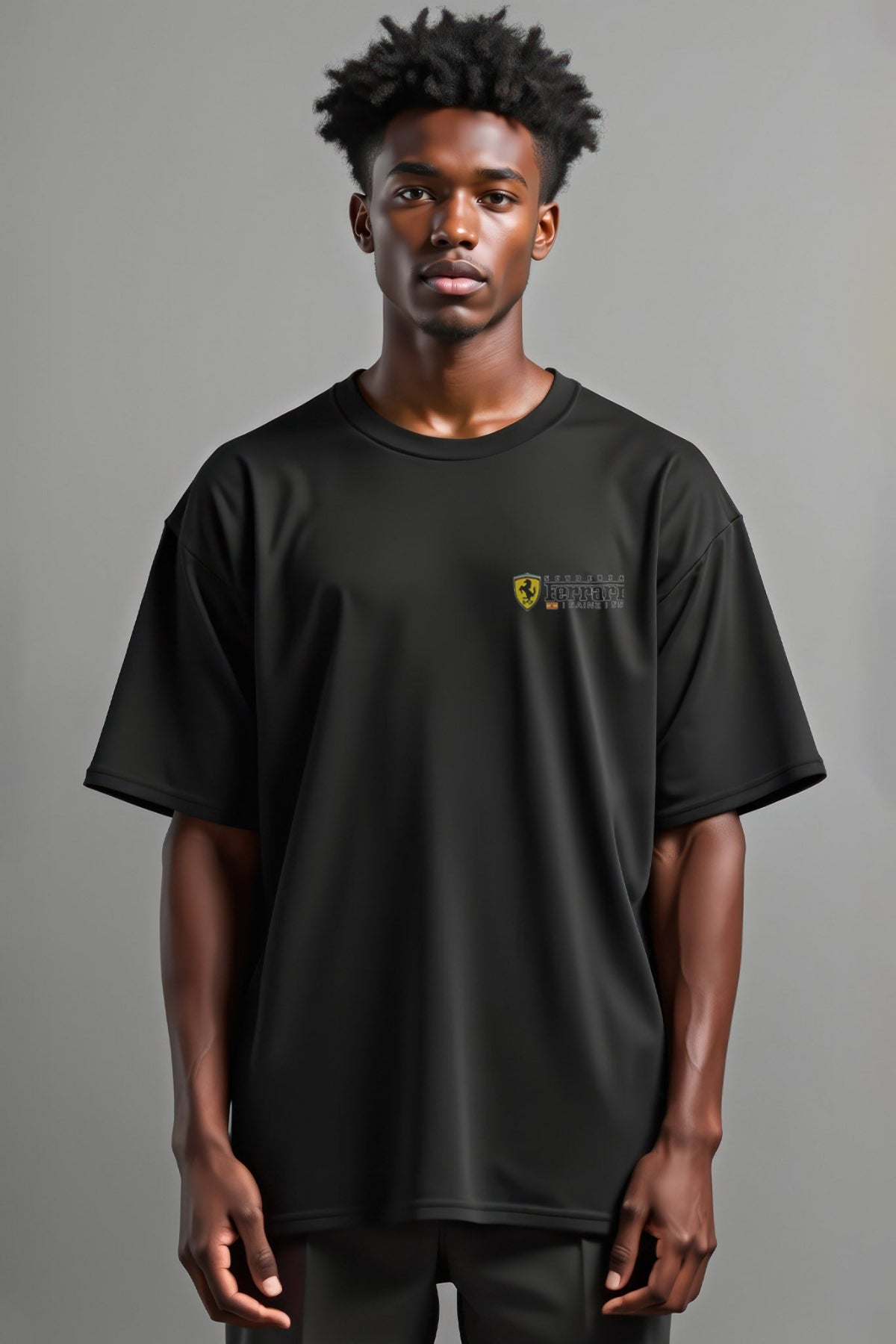 Man wearing a Carlos Sainz inspired, custom Ferrari graphic tee. Highlighting the front design. Printed direct-to-garment on a Black Comfort Colors shirt.