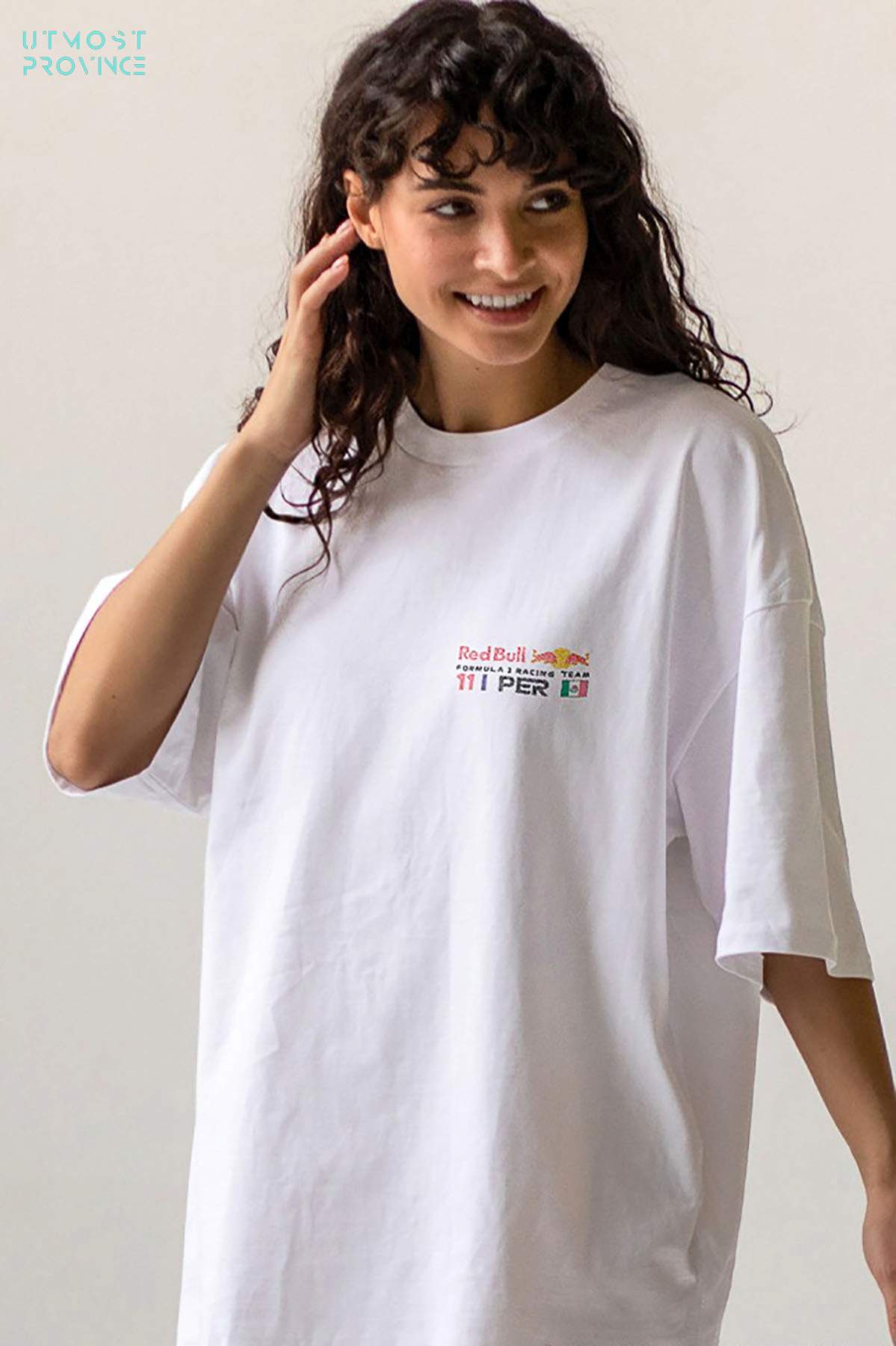 Model wearing Utmost Province Red Bull Racing shirt inspired by Checo Perez, showcasing the front design.