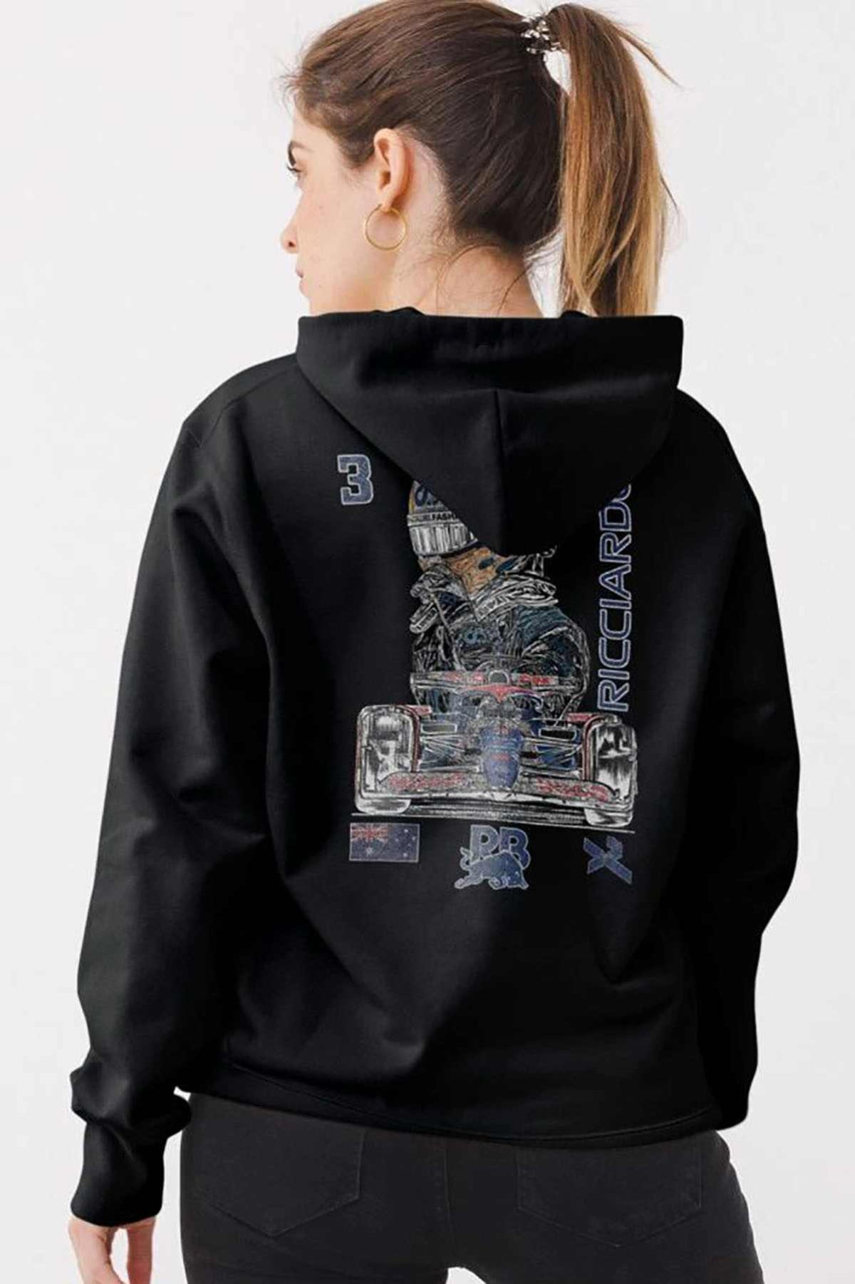 Person wearing a black hoodie, showcasing the unique graphic design created by Utmost Province.