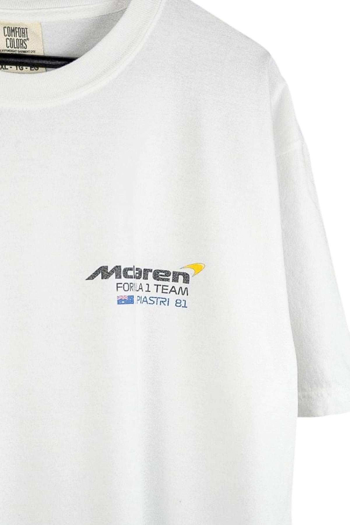 Utmost Province Oscar Piastri shirt on a hanger, showcasing the front graphic design on the Mclaren F1 merch.
