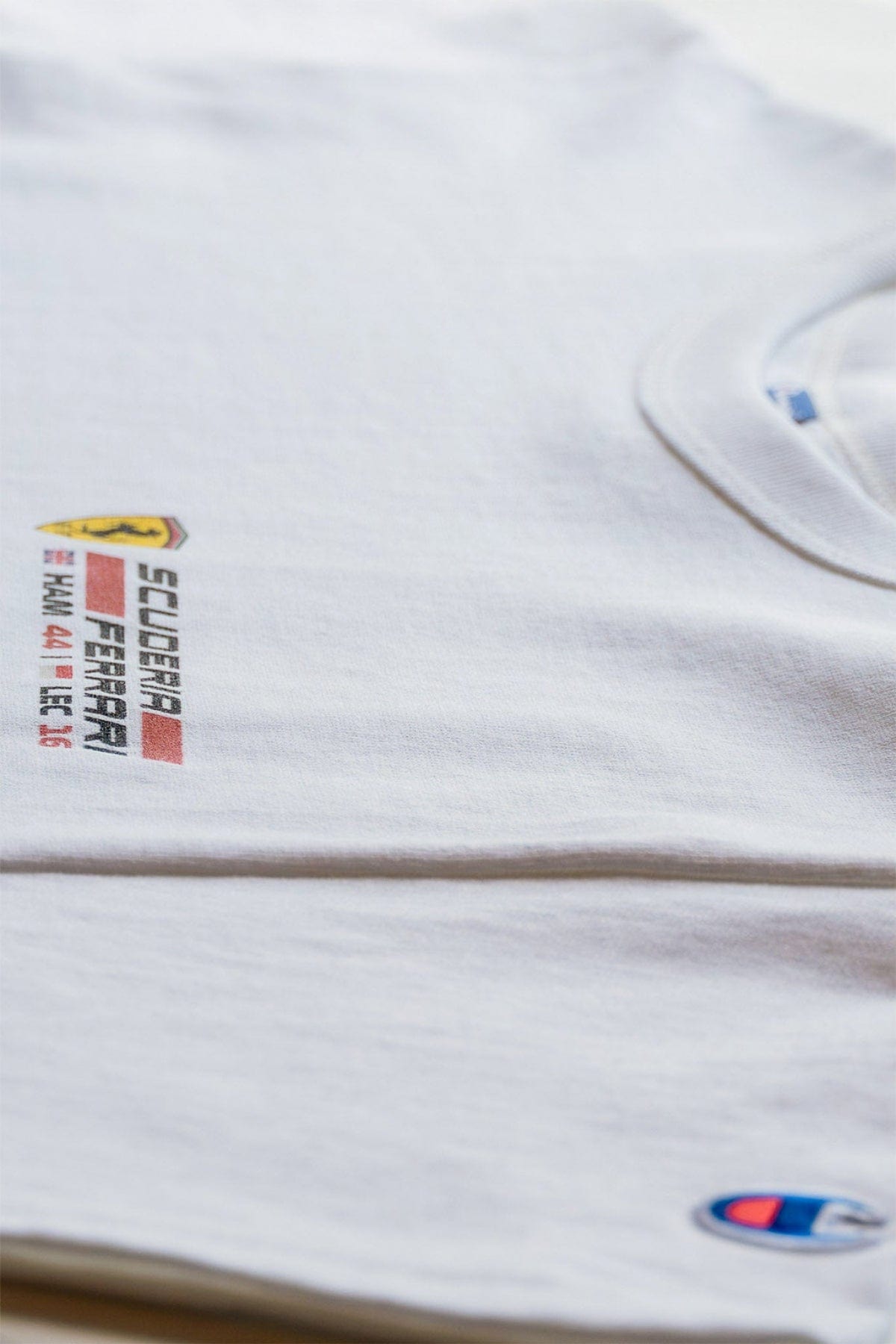 Front of a white Ferrari F1-inspired crop top, designed by Utmost Province®.