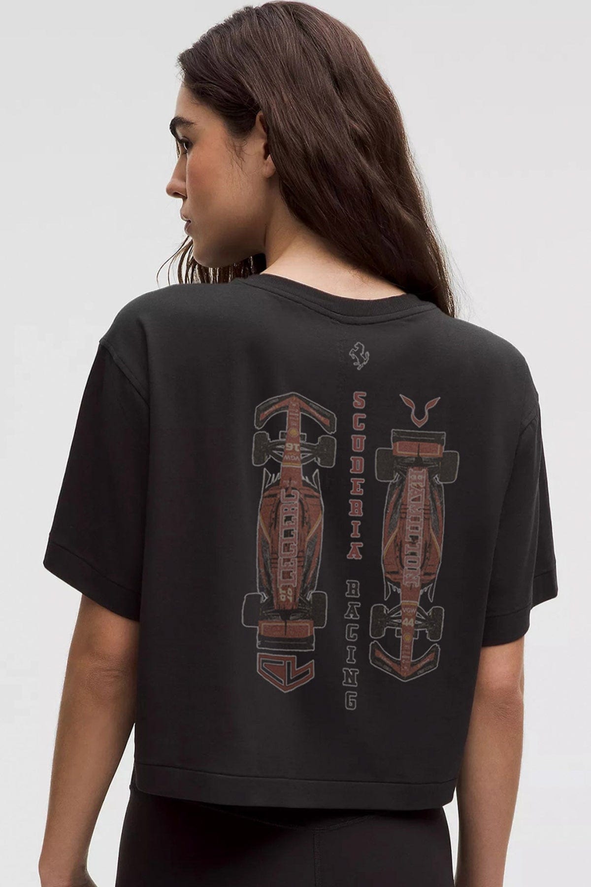 Women wearing a Scuderia Ferrari-inspired crop top, designed by Utmost Province®.