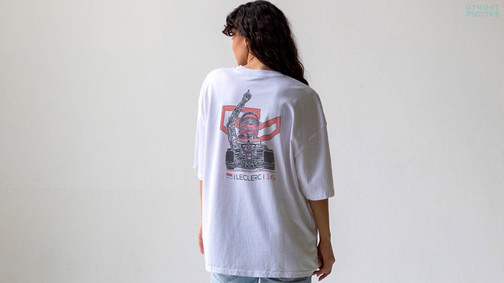 Model wearing a white t-shirt with a Charles Leclerc-inspired graphic design on the back.