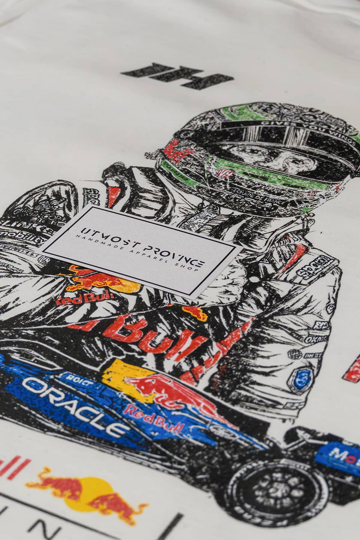 Close up of Utmost Province Red Bull Racing tshirt, highlighting the design on the back of a white Comfort Colors cotton tee.