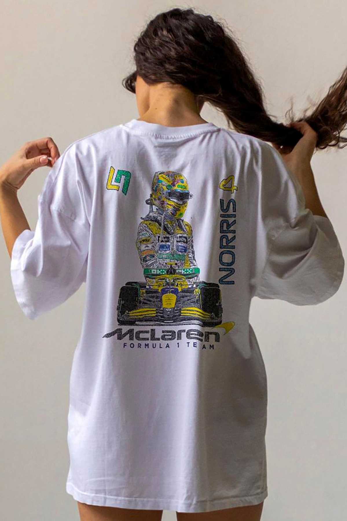 Model wearing Utmost Province Mclaren F1 shirt, showcasing the exclusive custom graphic design on the back of the unisex t shirt.