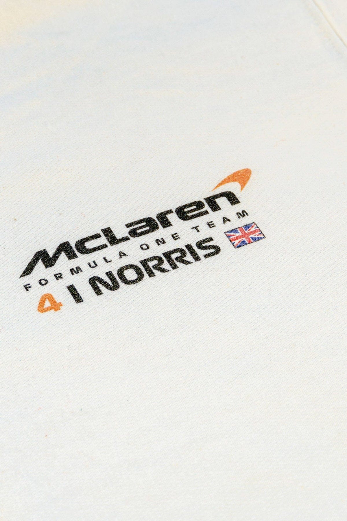 Close up of the front of Utmost Province custom Lando Norris hoodie, showcasing the unique graphic design.