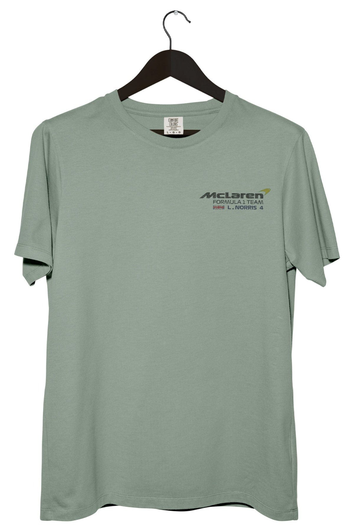 Front of a bay Comfort Colors shirt with a custom Mclaren logo.