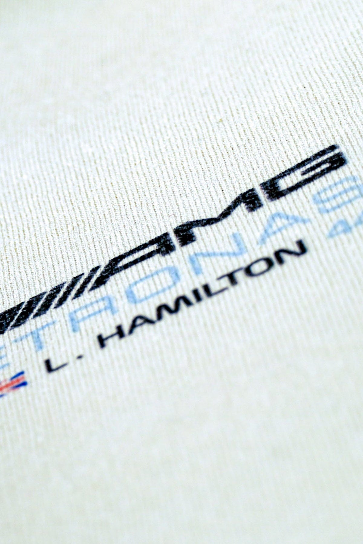 Close up of the from of Utmost Province's custom shirt Mercedes F1 graphic tee.