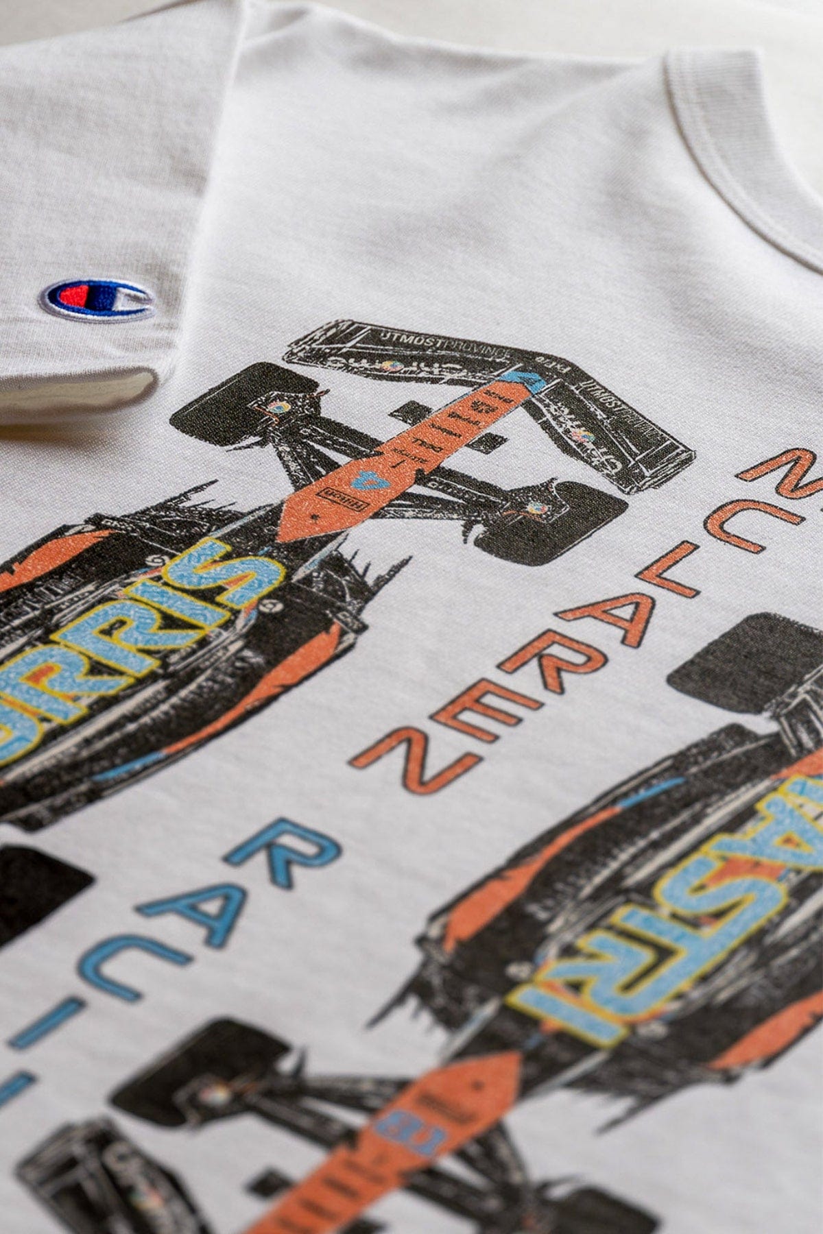 Close up of the back of Utmost Province custom Mclaren croptop for women.