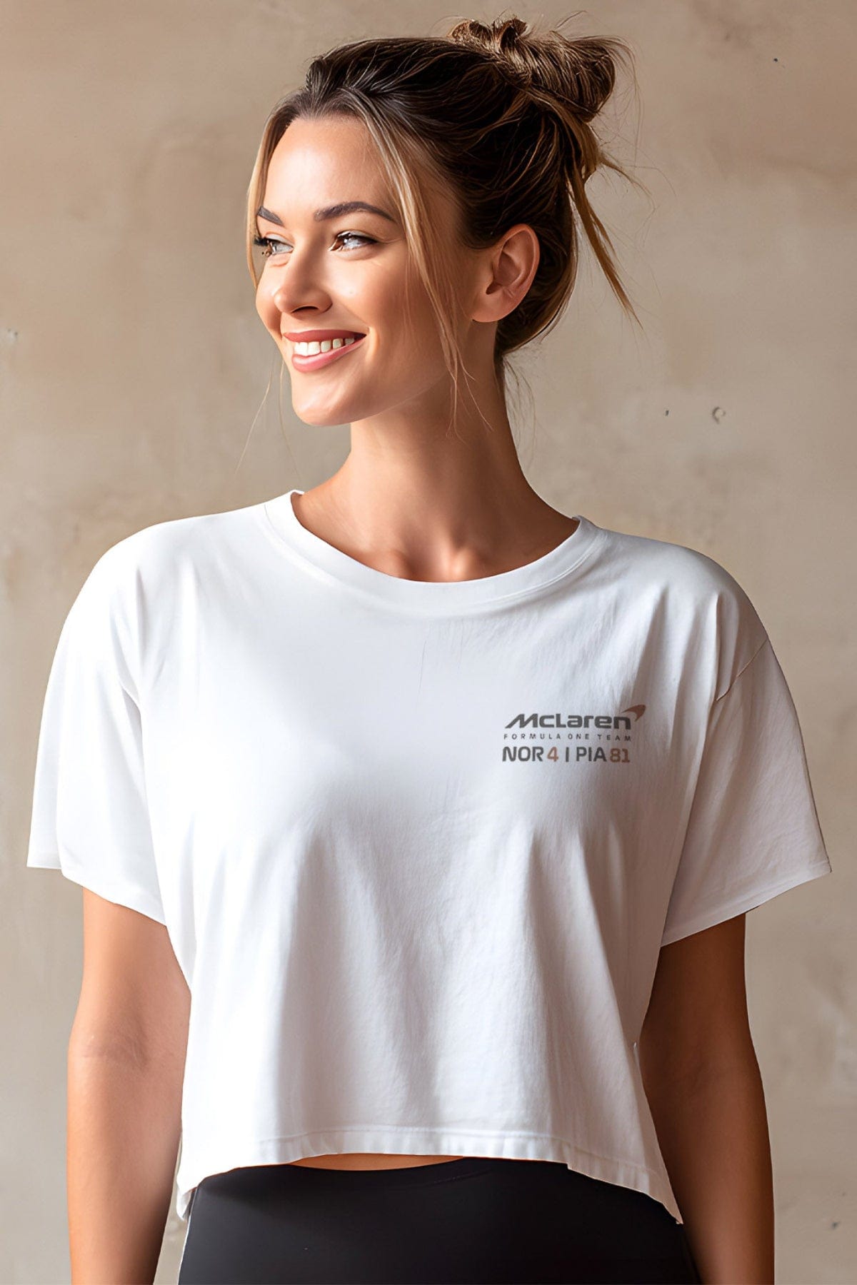 Person wearing a white custom Mclaren F1 shirt, showcasing the front of the cropped shirt.