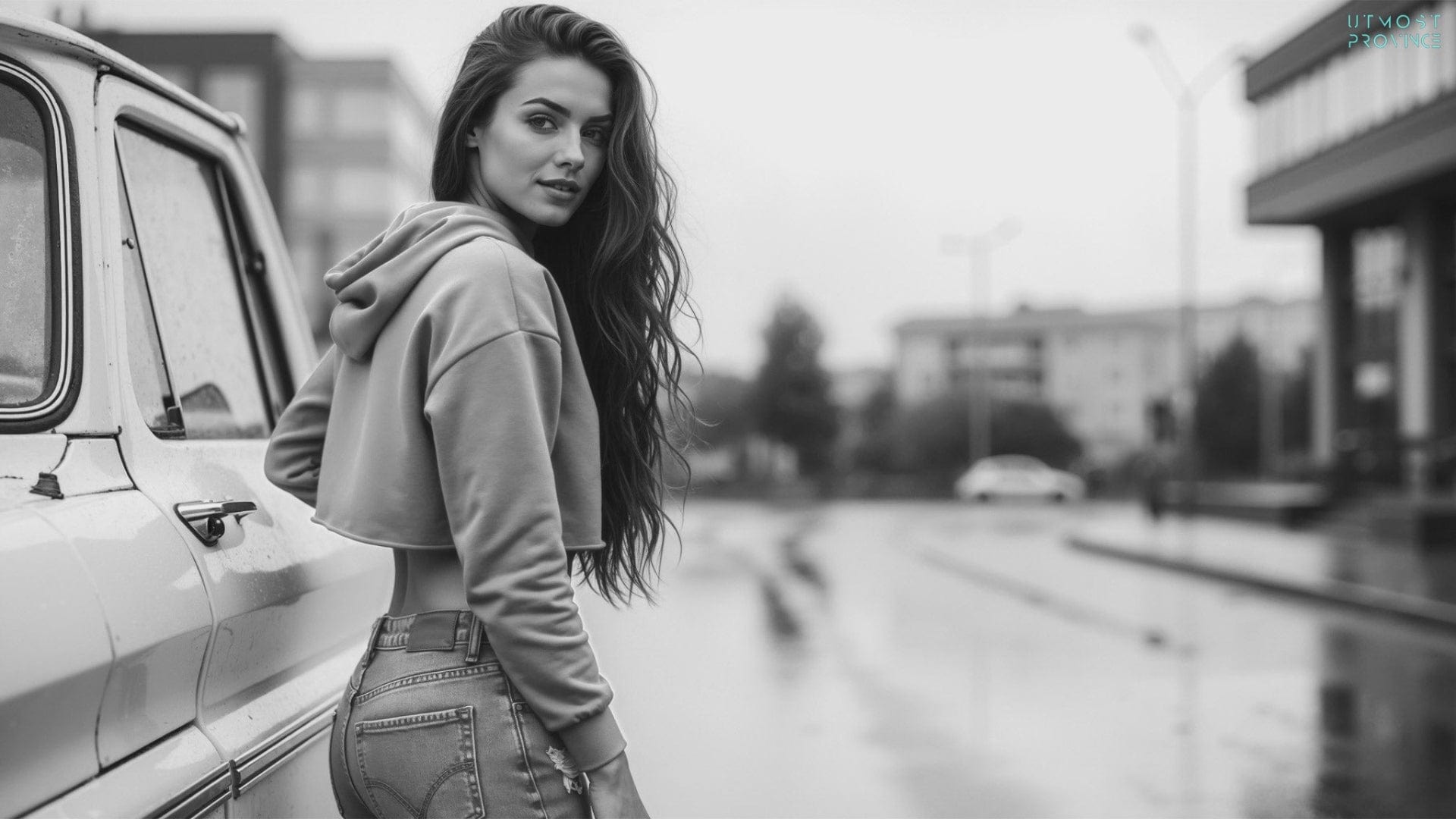 Woman in a crop top hoodie, standing outside, showcasing Utmost Province's new arrivals collection.