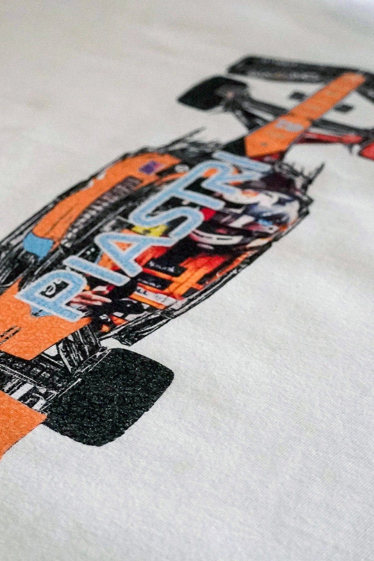 Close up of the back of a F1 t shirt featuring Utmost Province exclusive graphic design printed on the back.