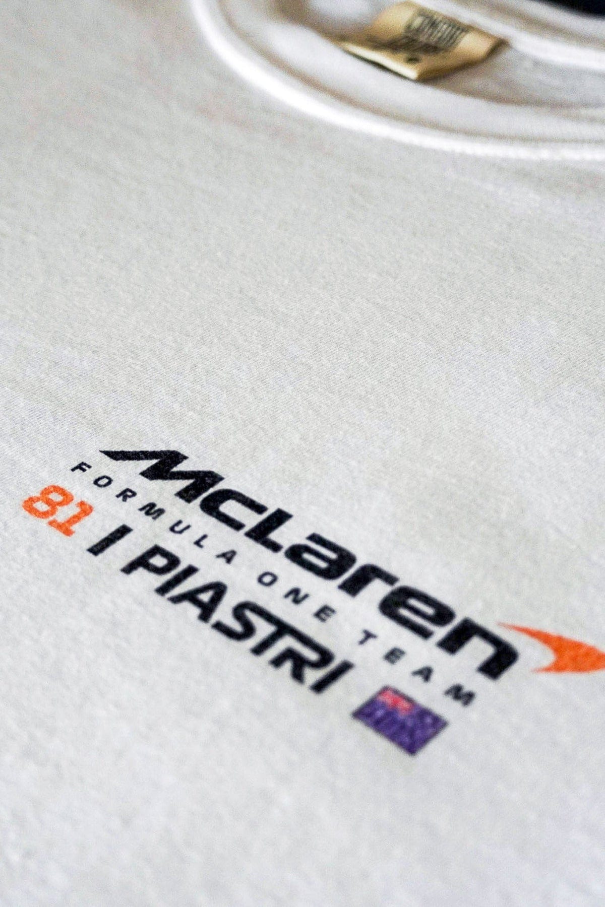 Close up of the front of Utmost Province Oscar Piastri F1 Mclaren T Shirt, showcasing the front of the graphic tee.
