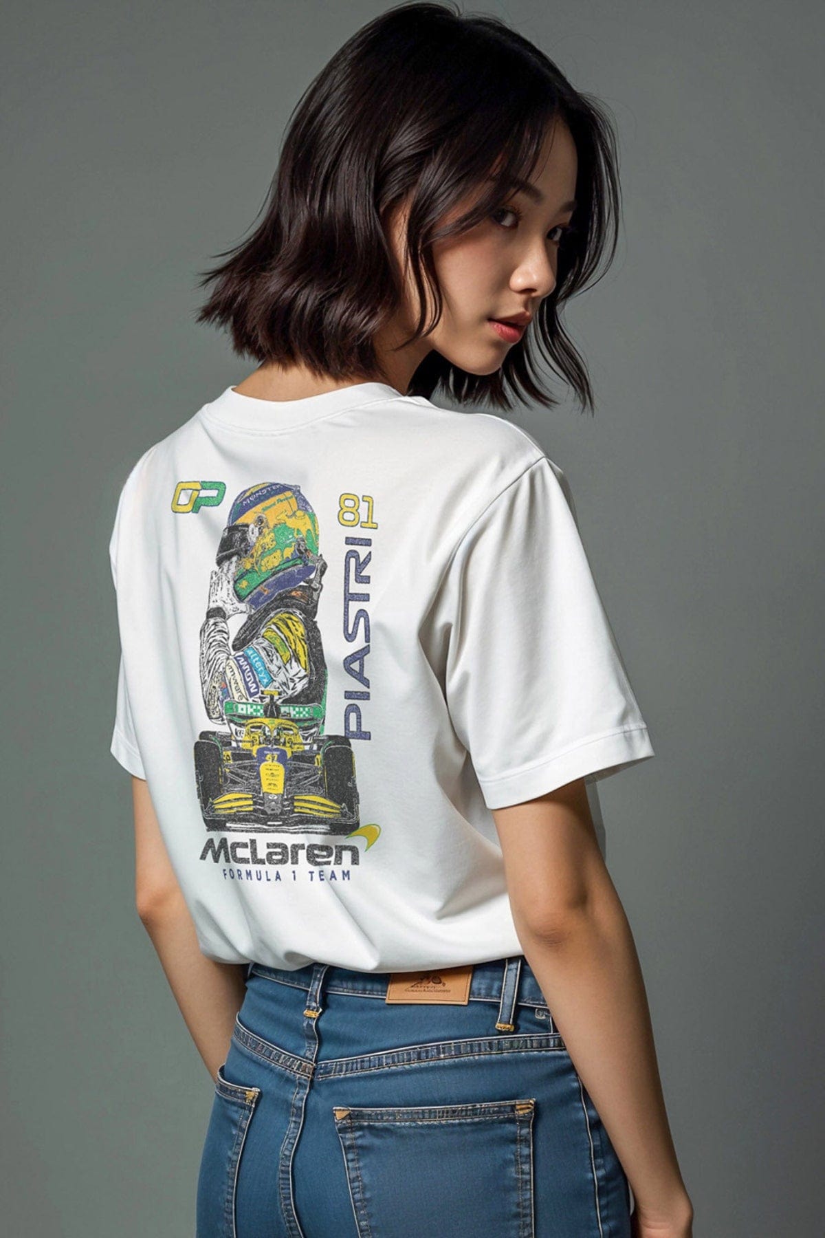Model wearing a Oscar Piastri Mclaren shirt, showcasing the graphic design on the back of the t-shirt.