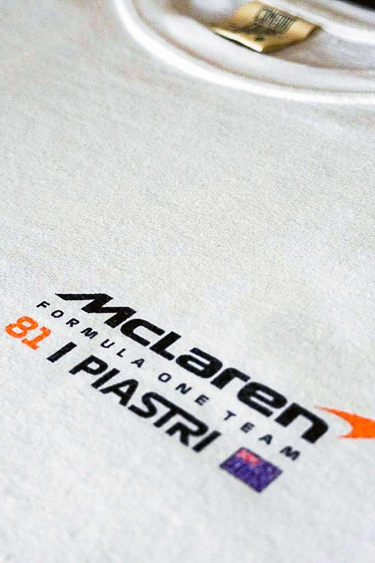 Utmost Province Oscar Piastri t shirt, highlighting the graphic design on the front of the Mclaren inspired merch.