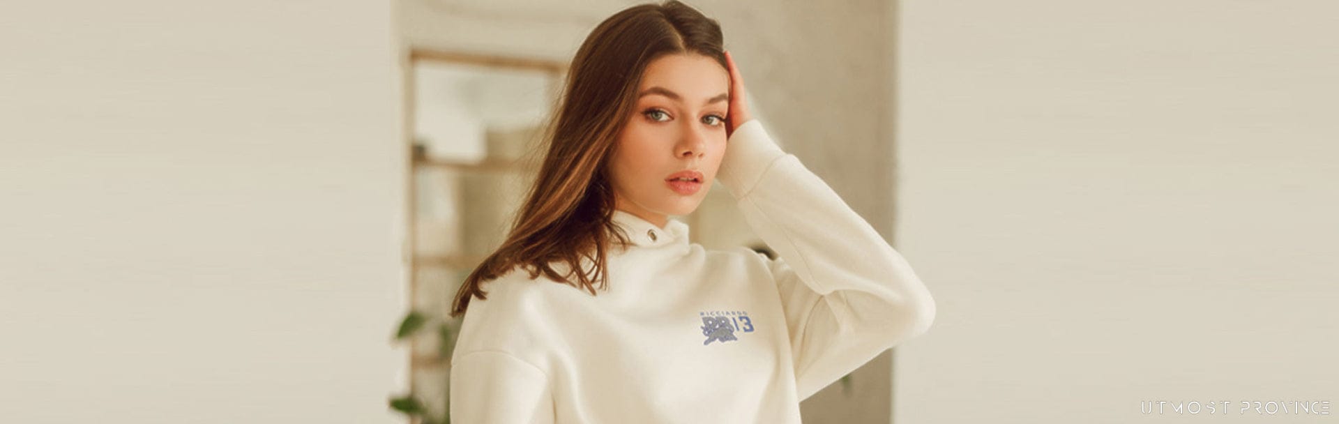 Model wearing a custom Racing Bulls hoodie, showcasing Utmost Province Red Bull Racing merch collection