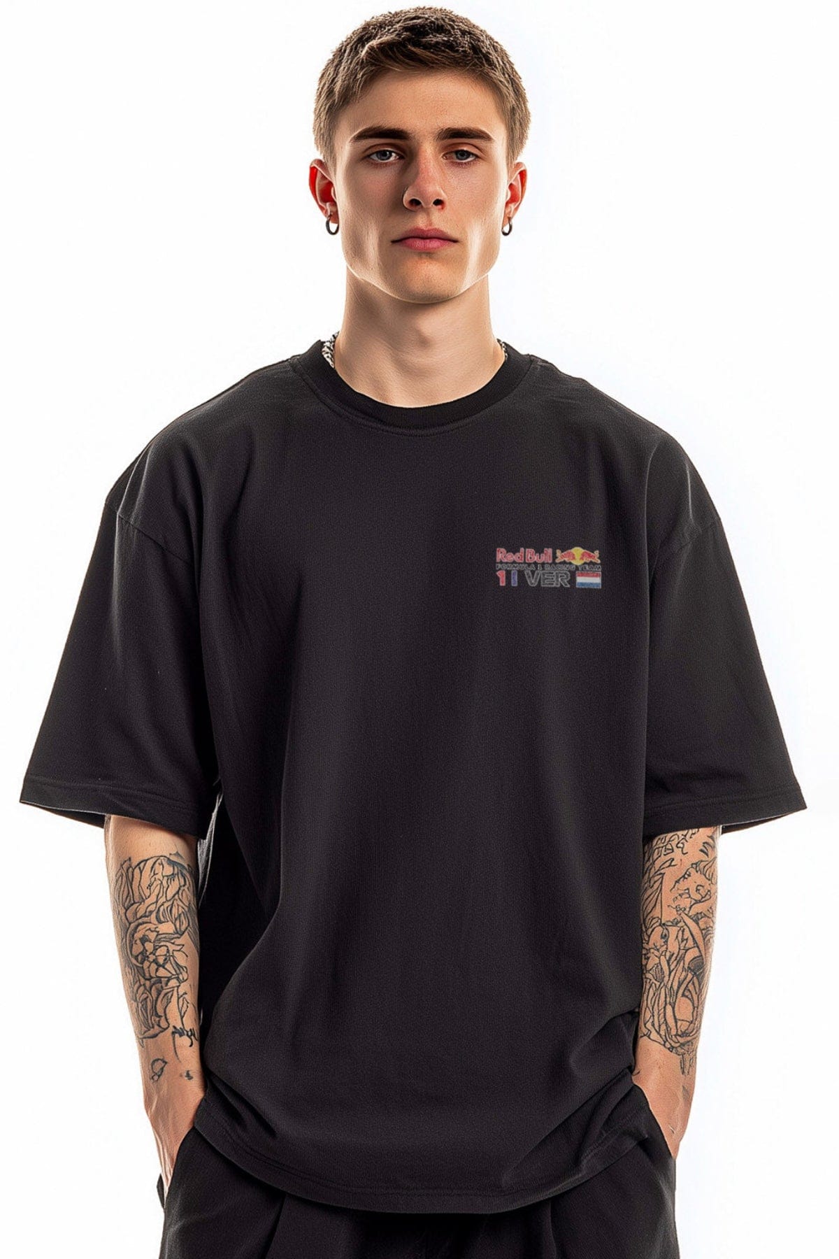 Man wearing a black Red Bull F1 shirt with a white background, showcasing the front design.